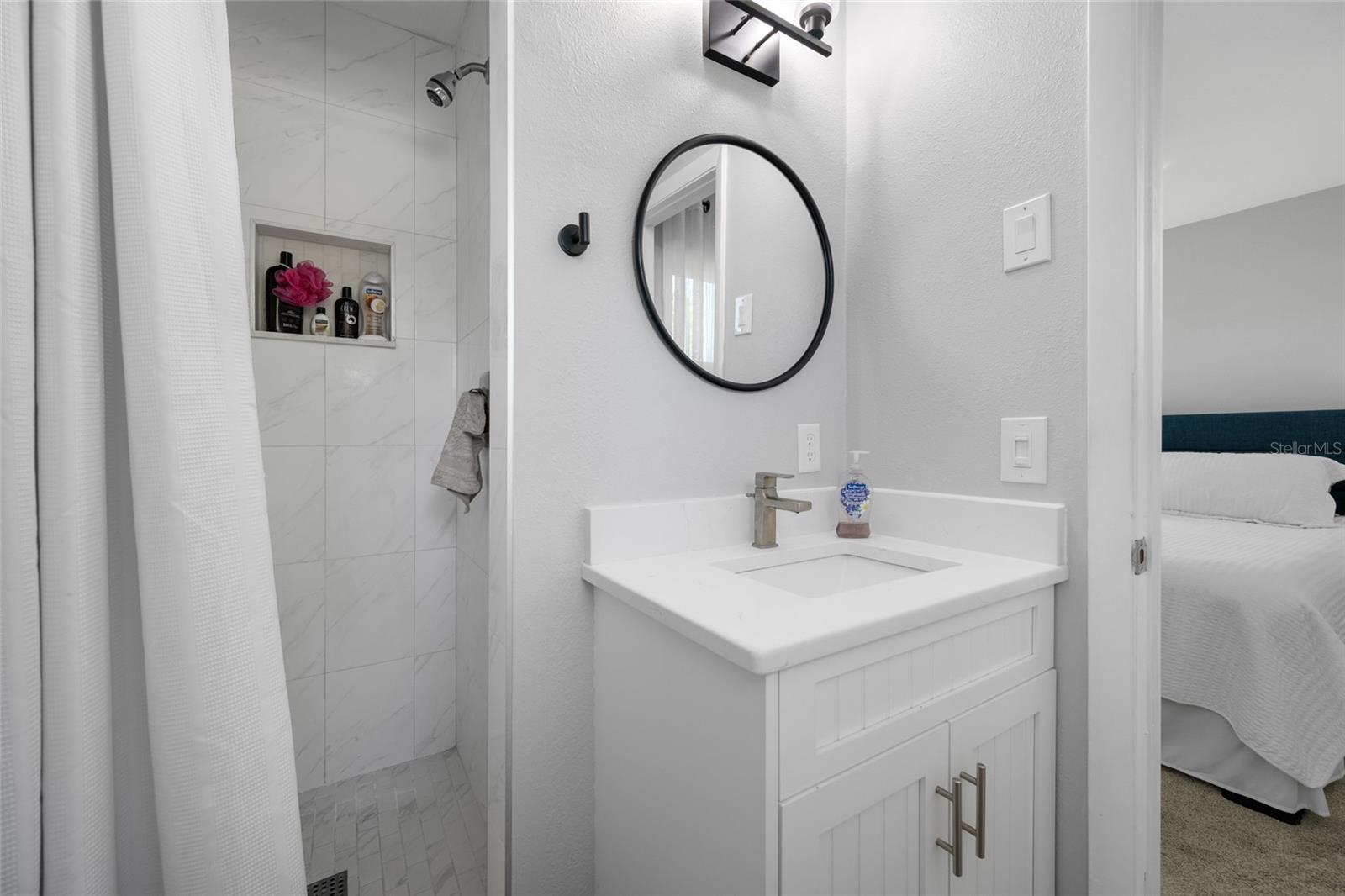 Primary Bedroom with ensuite updated bathroom featuring walk-in shower