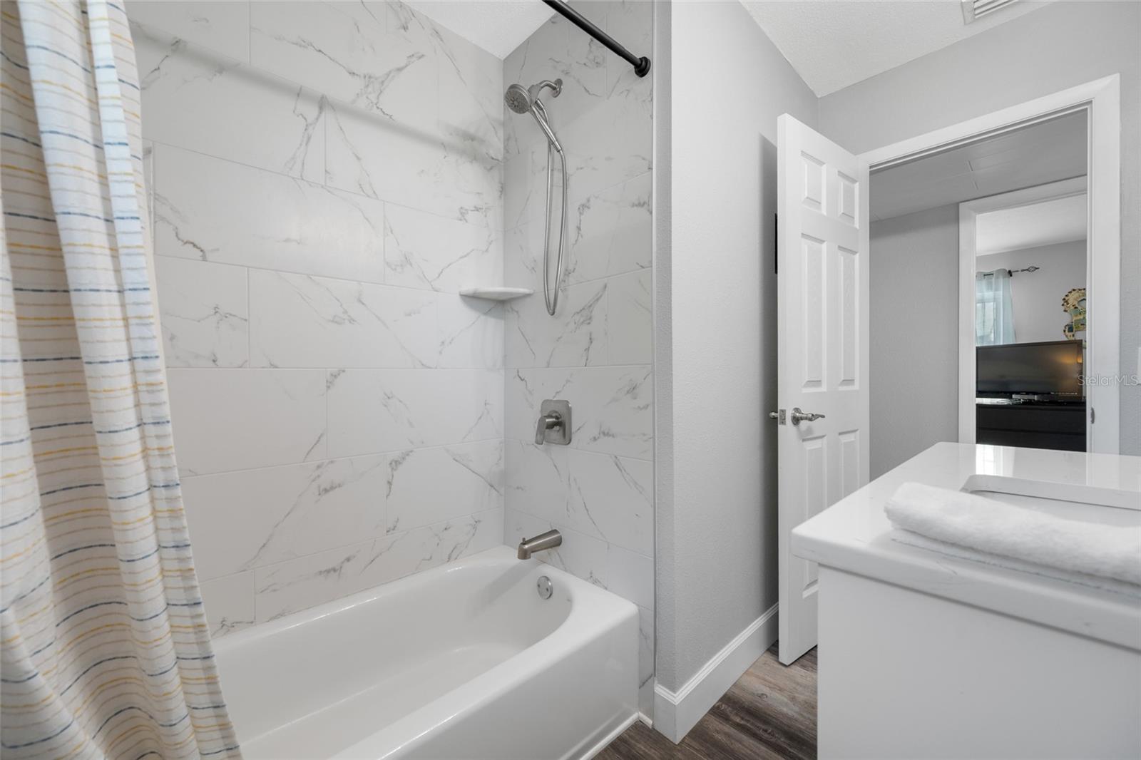 Hall bathroom with bathtub & shower