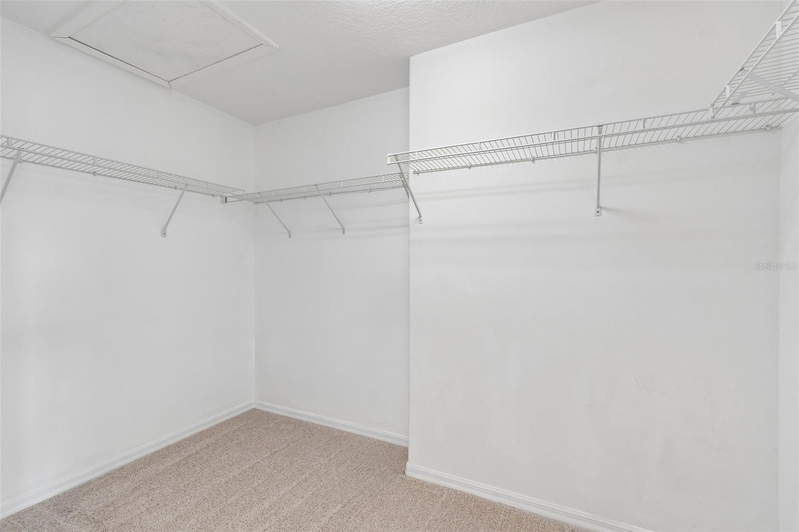 Primaty bedroom walk-in closet