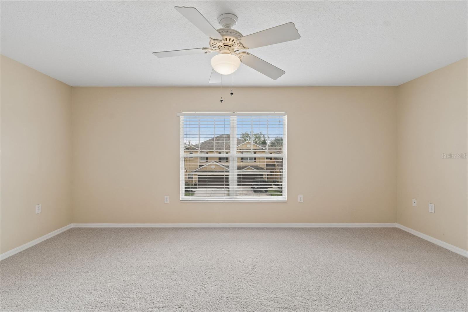 Primary bedroom with view of natural preserve
