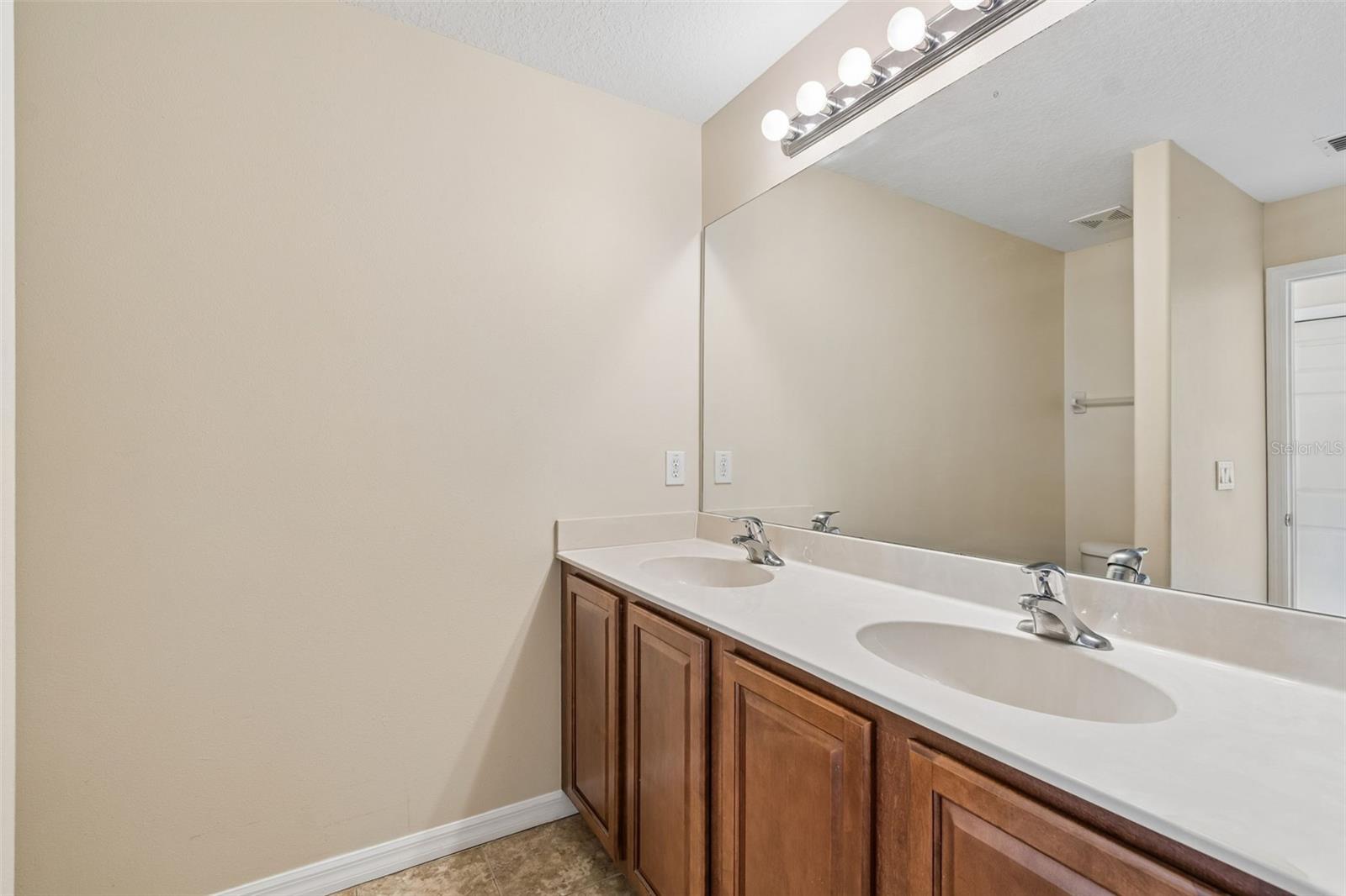 Primary bathroom double sink vanity