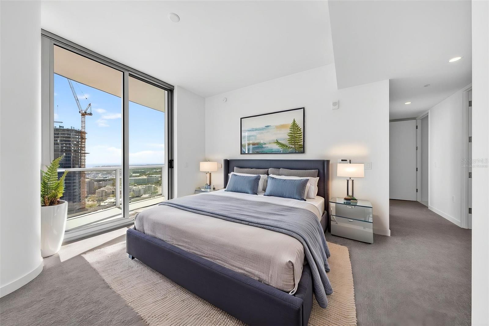 Primary Bedroom /double sliders going out onto the terrace