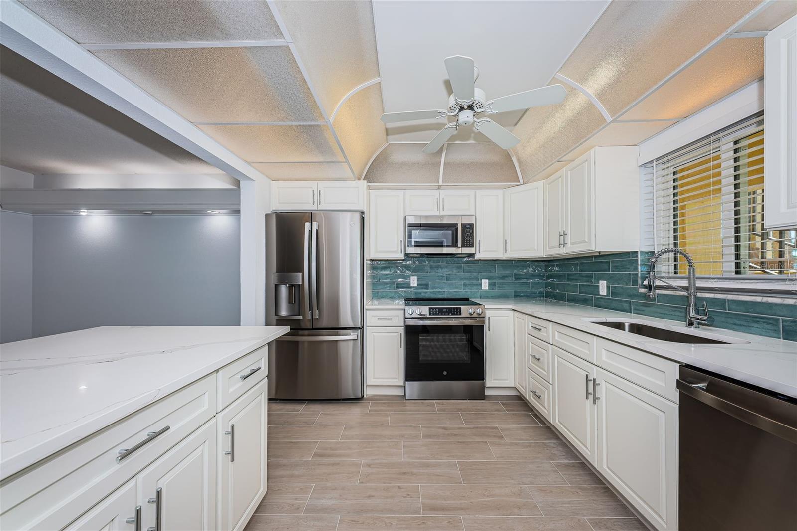 Kitchen with new cabinets, quartz counter tops, stainless steel appliances
