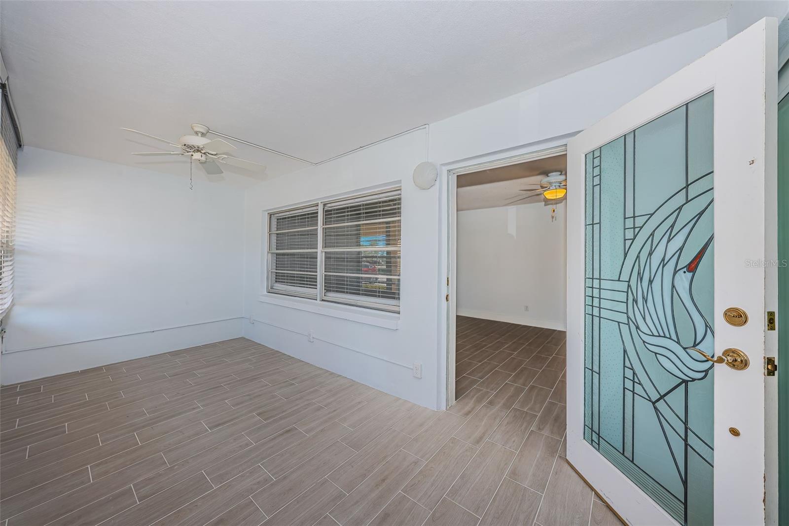 Florida room with front door to the living room