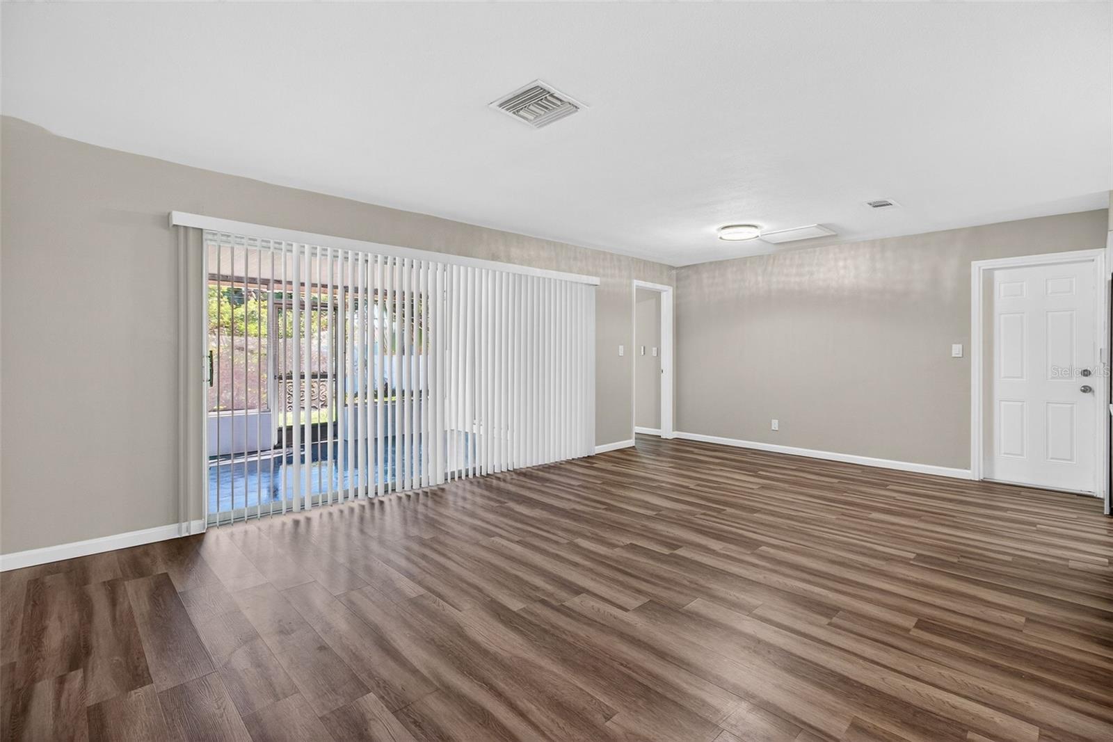 Expansive dual access sliding glass doors