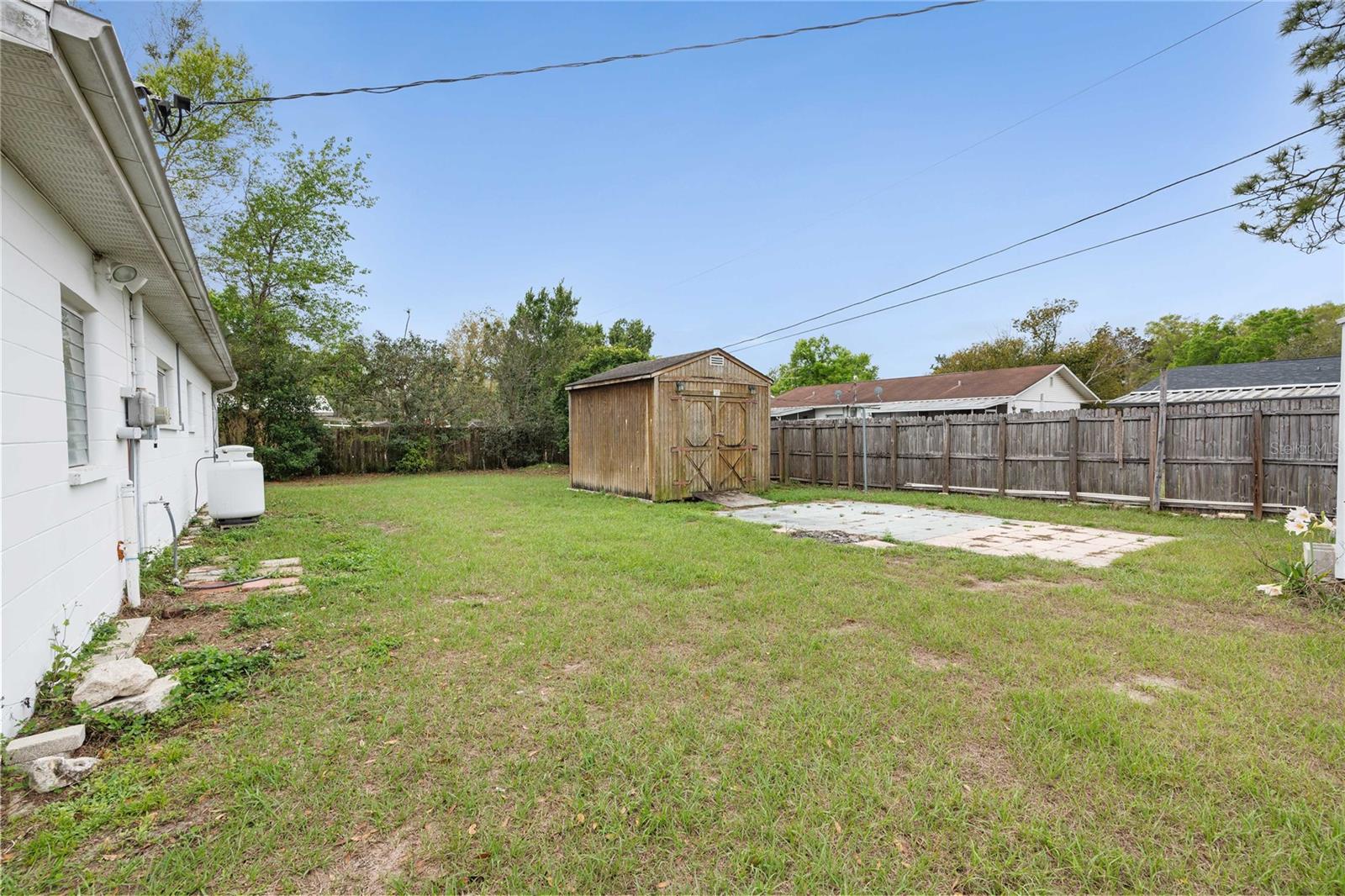 Nice backyard with two storage sheds.