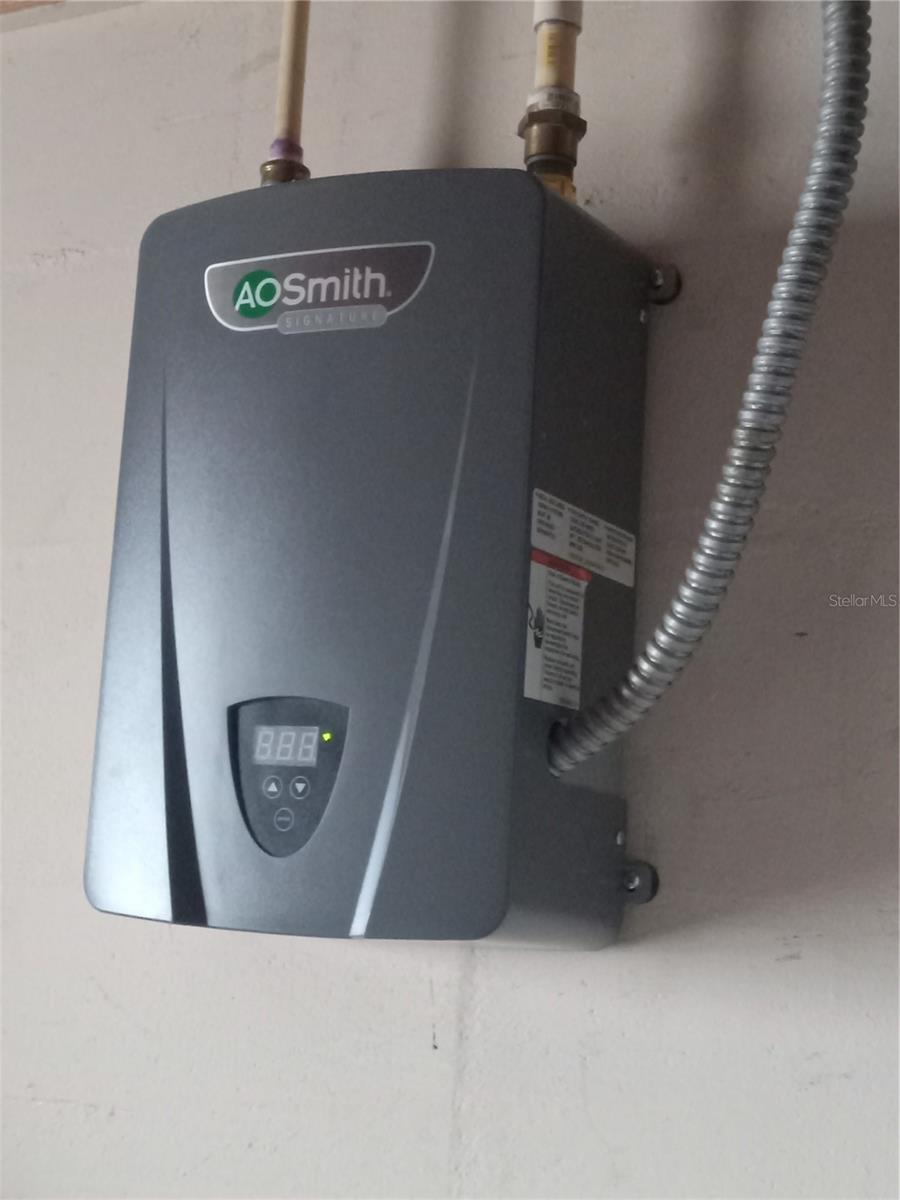 New tankless hot water heather in garage