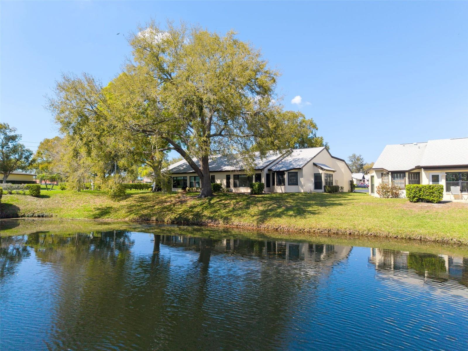 A special villa home offering scenic Sutton Place pond & nature views~