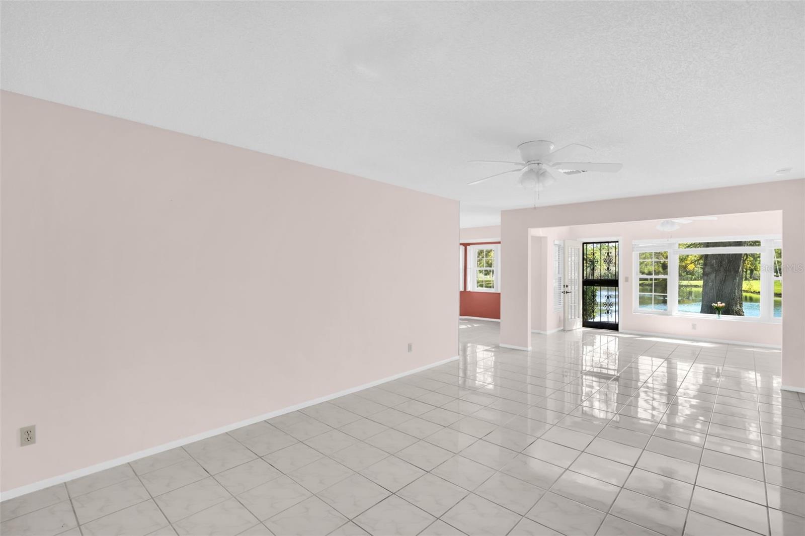 Matched tile flooring in living room, den, dining room & kitchen~