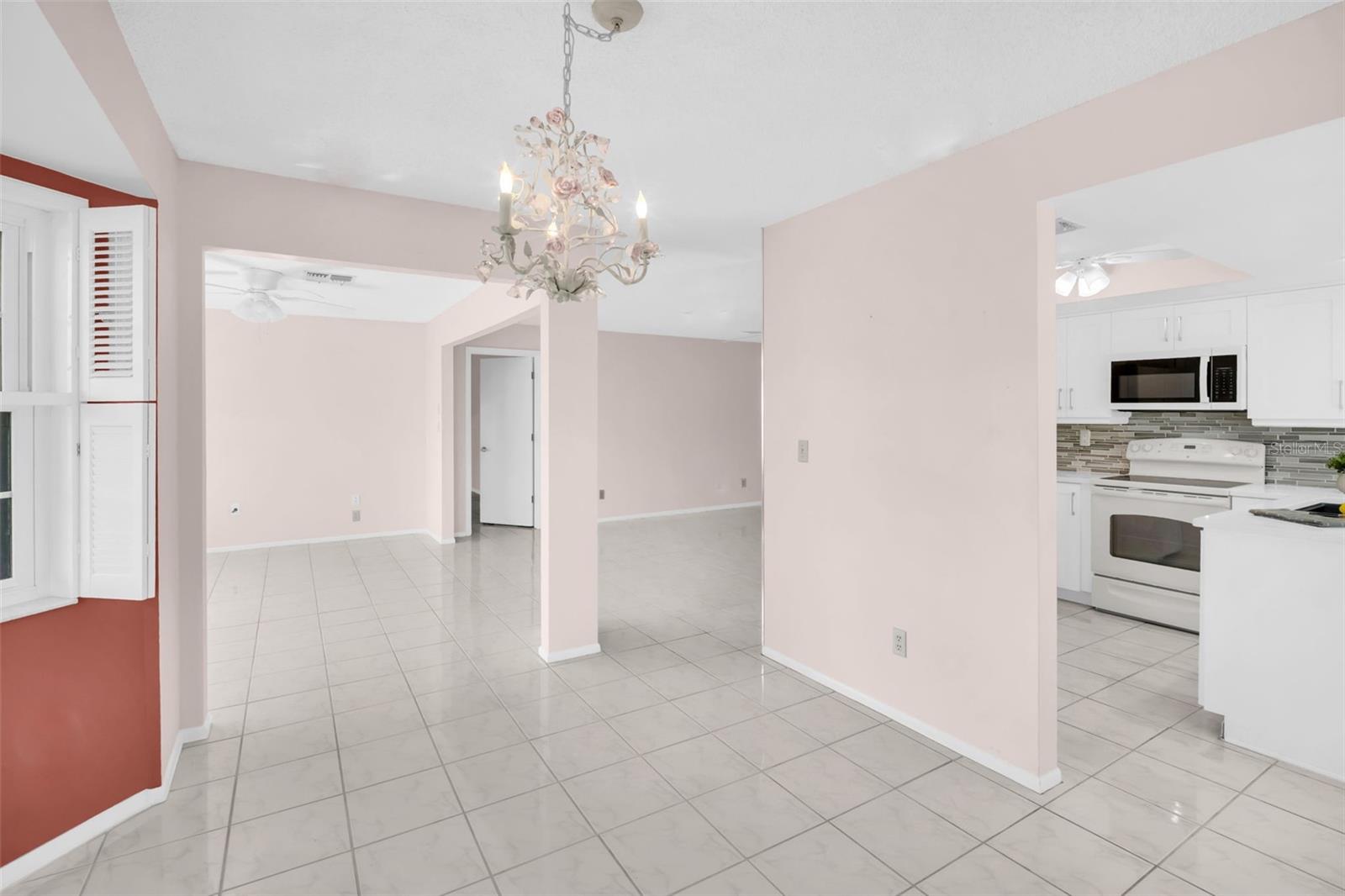 Living room & den open to the dining room with wide bay window~
