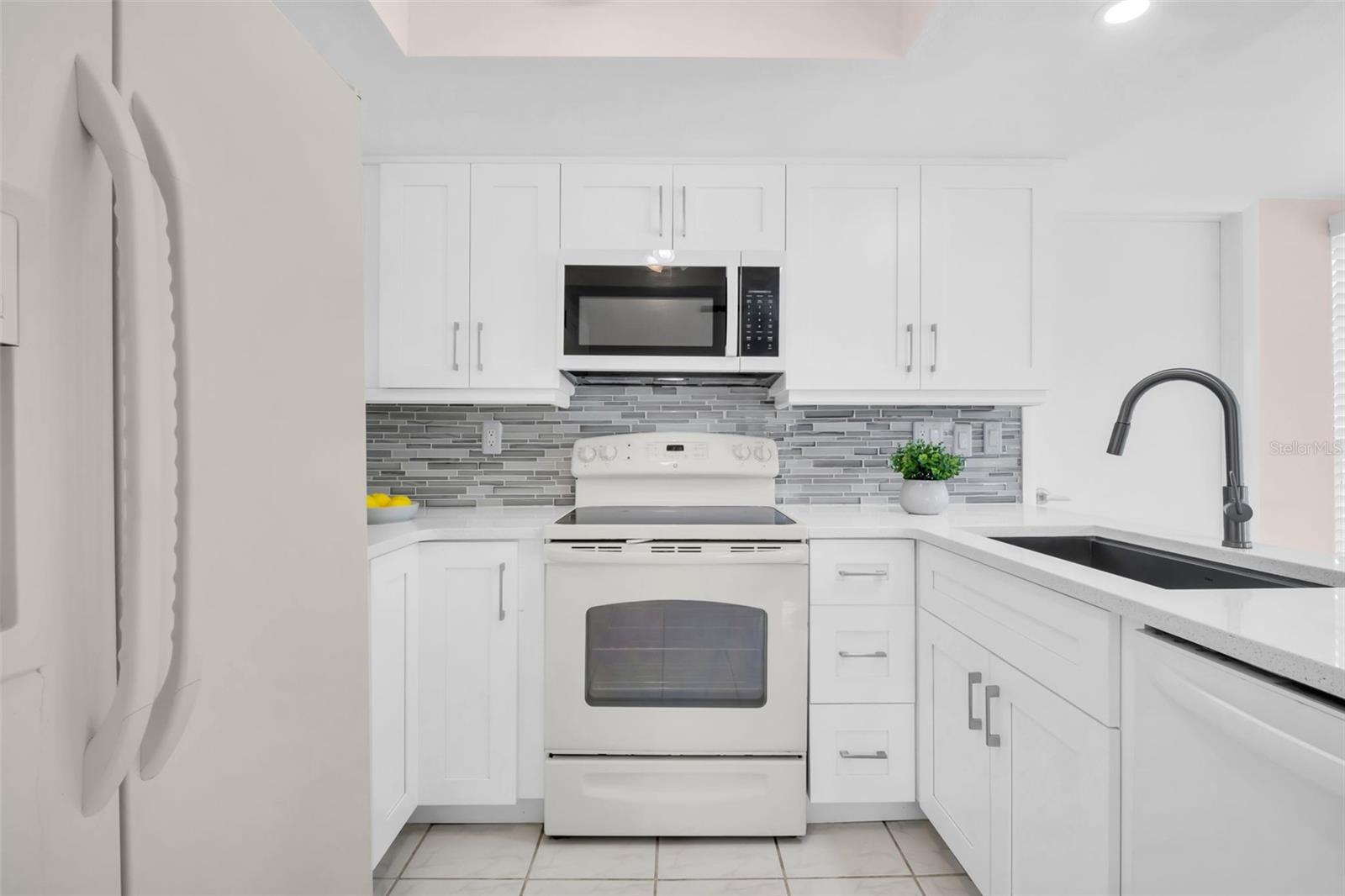 The dishwasher and microwave are both new within 5 years. A tray ceiling replaces the old plastic lumidome florescent fixture~