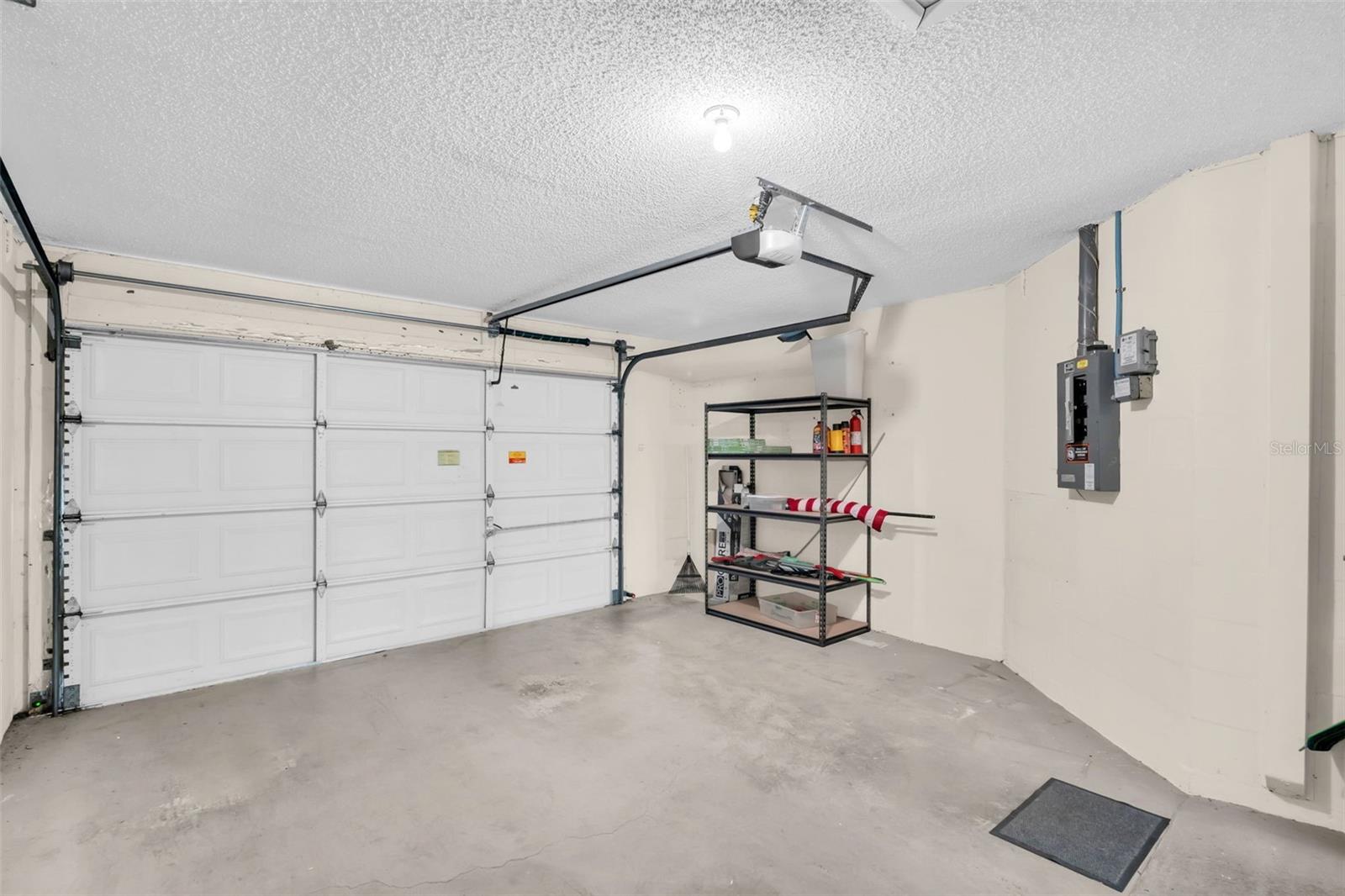 Garage is wide enough for a car or truck & a golf cart. You can take a golf cart on the roads in Highland Lakes~