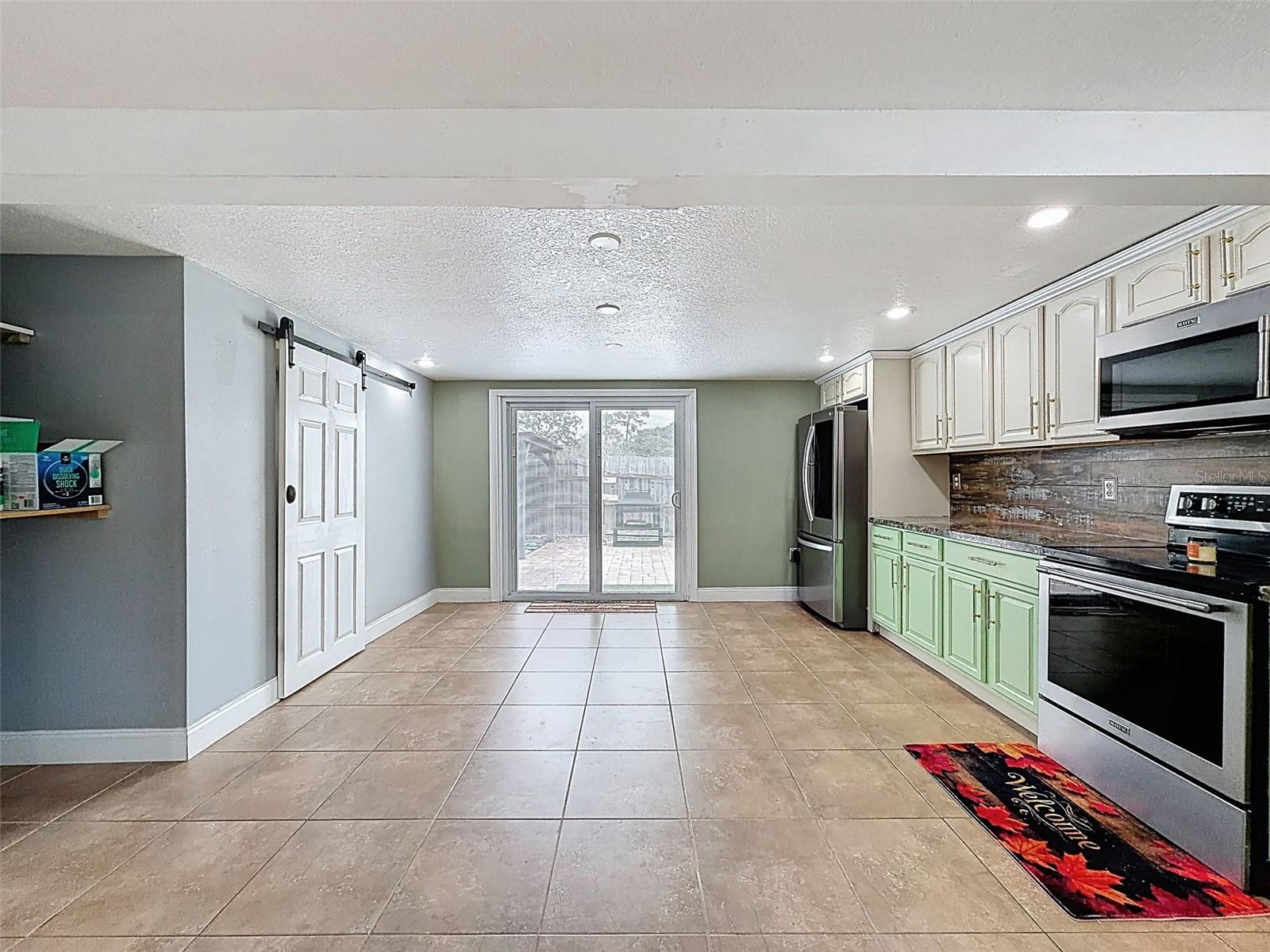 BEHIND THIS BARN DOOR IS THE KITCHEN PANTRY!
