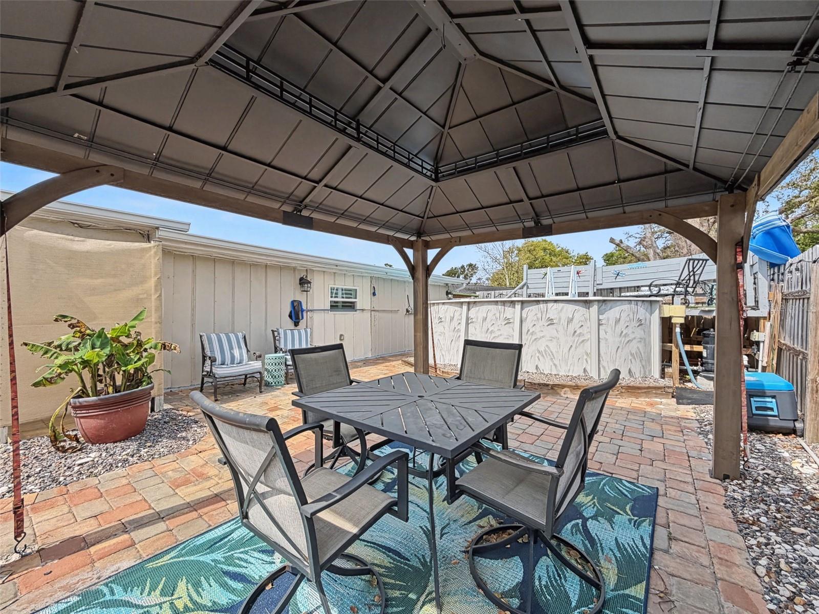 OUTDOOR SHOWER  AREA BEHIND THE PLANT.