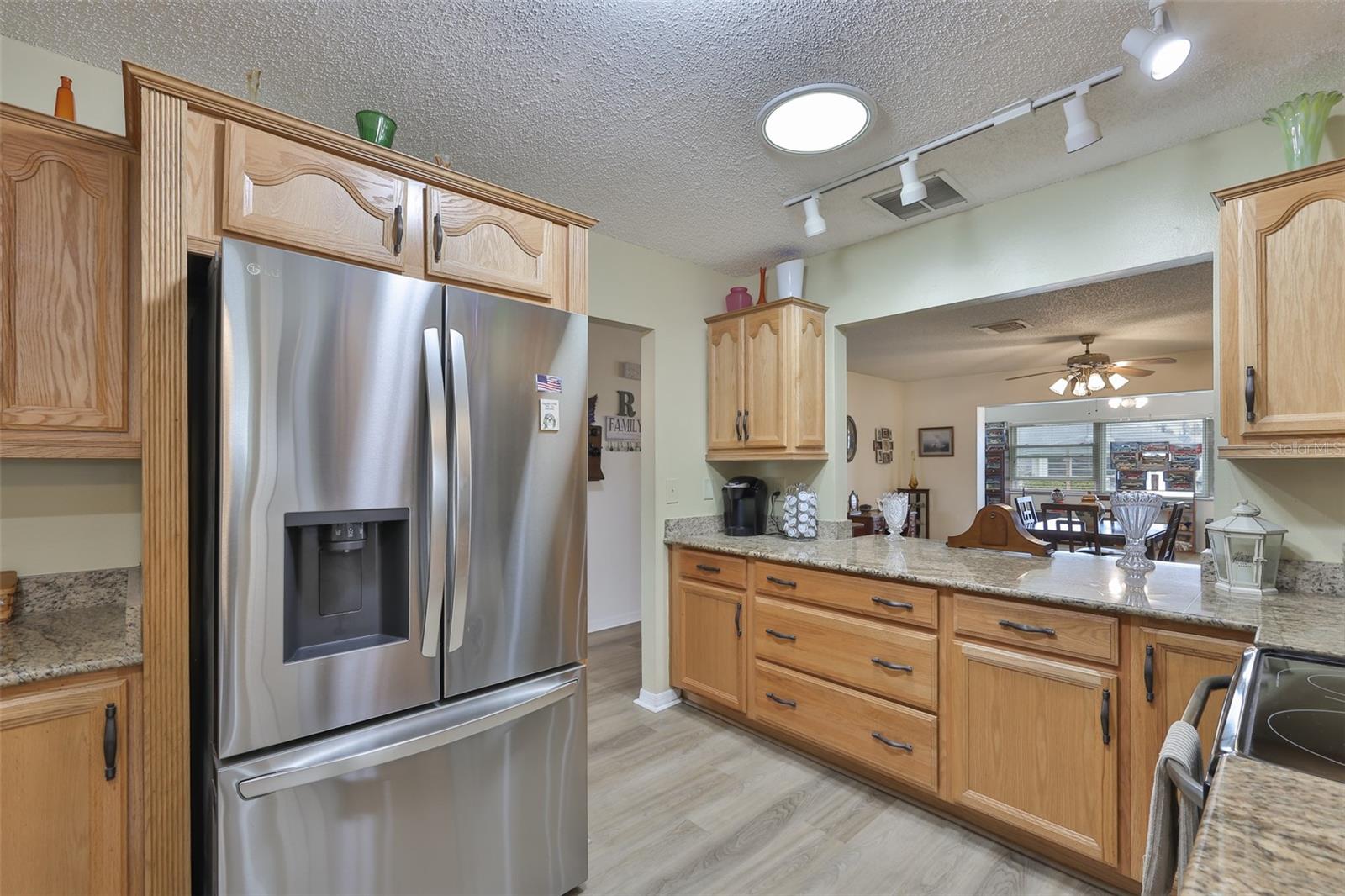 Granite Countertops, Breakfast Bar, Ample Wood Cabinets