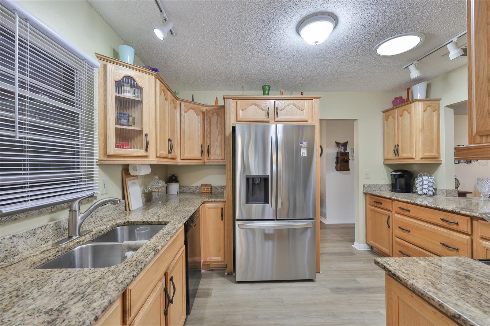 Granite Countertops, Breakfast Bar, Ample Wood Cabinets