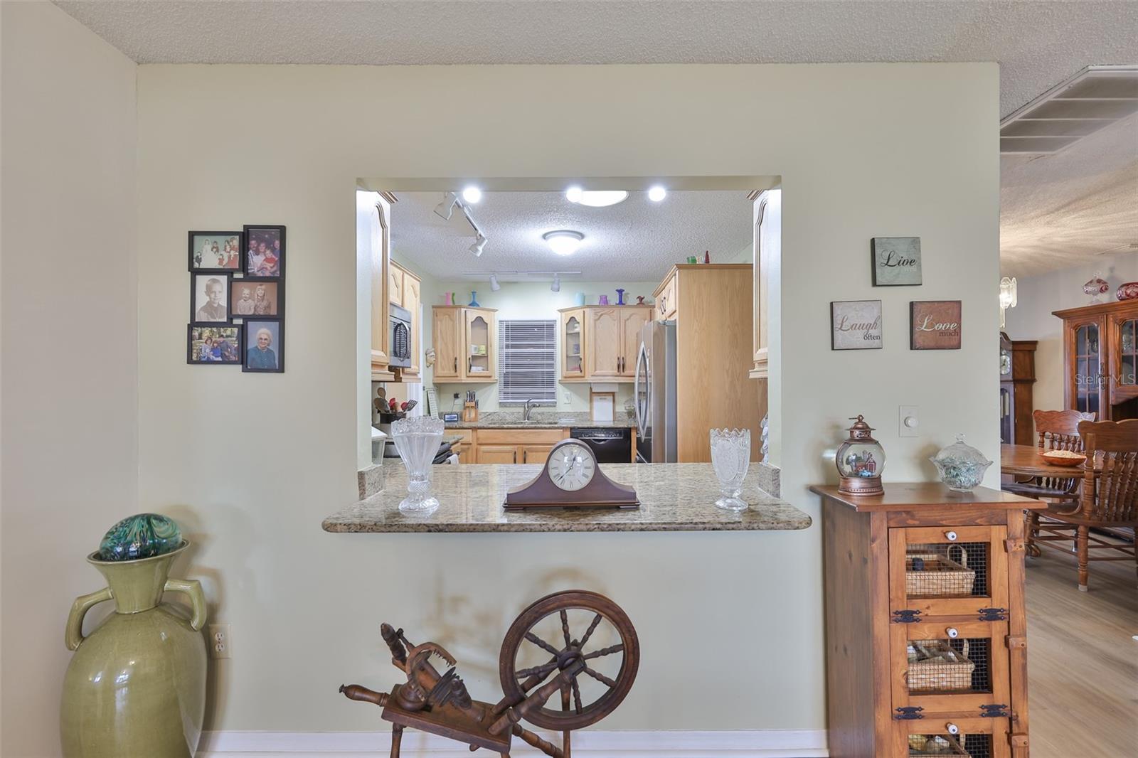 Beautiful Granite Countertops & Pass-Thru Breakfast Bar