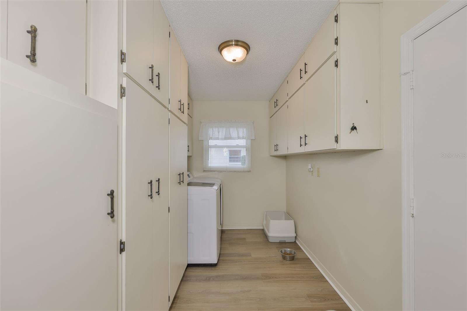 Oversized Laundry Room, Plenty of Storage Cabinets