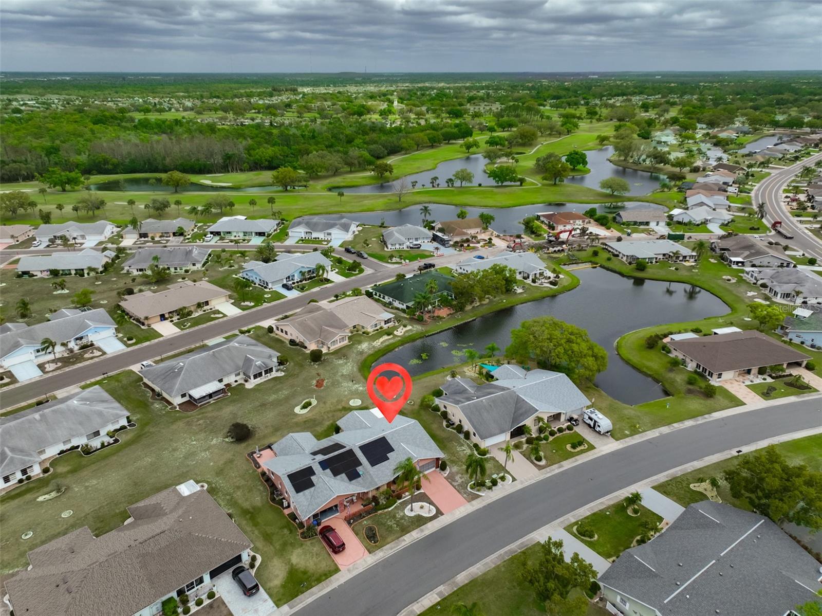 Aerial SCC, Solar Panels Let You Save on Your Electric Bill, Side Pond View