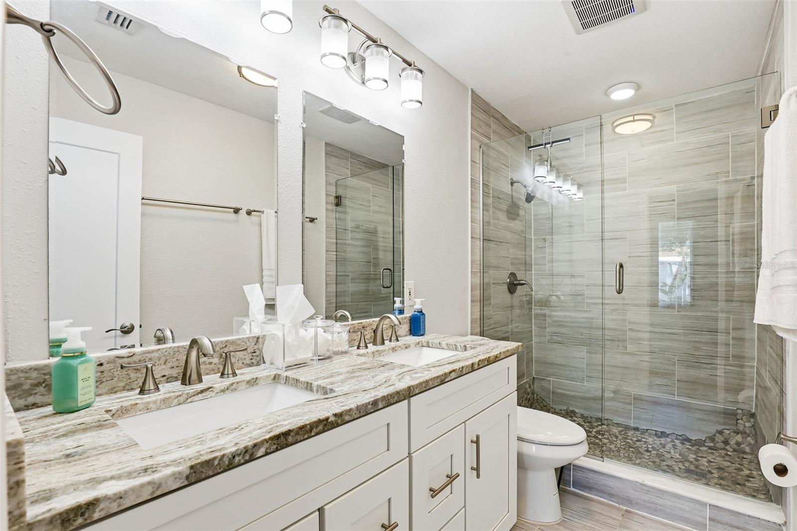 stunning primary bathroom with large walk in shower
