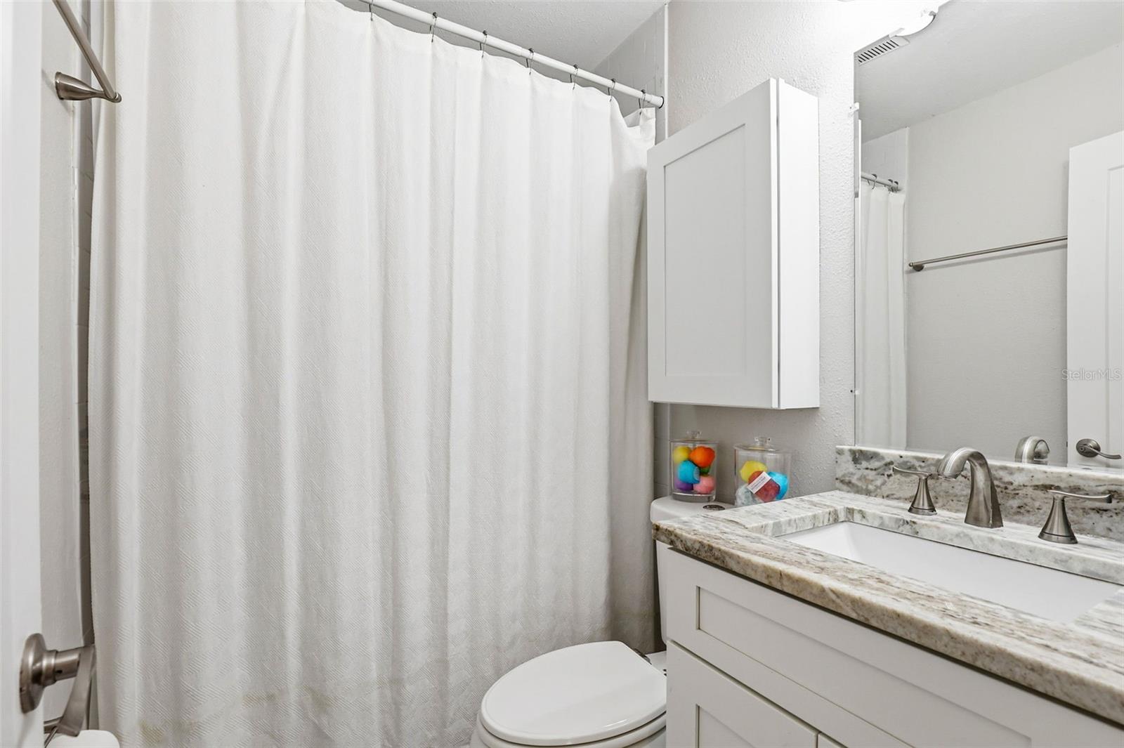 guest bath with tub/shower in main house