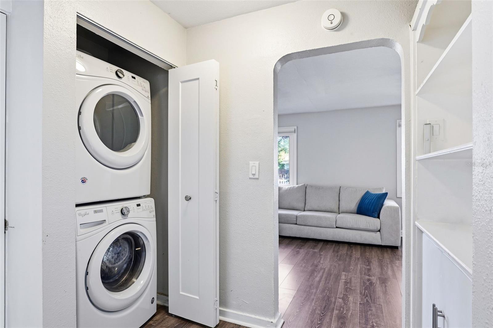 laundry closet with stackable washer and dryer