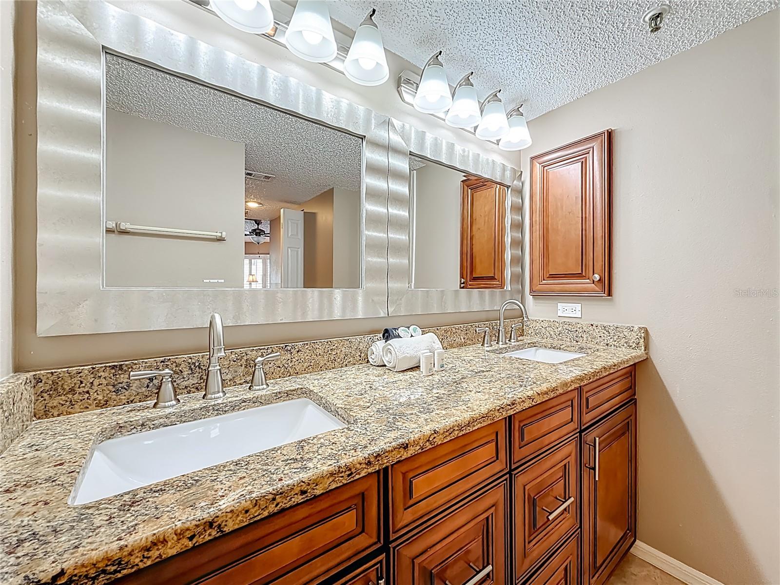 Granite counter tops and Solid Wood Vanity!