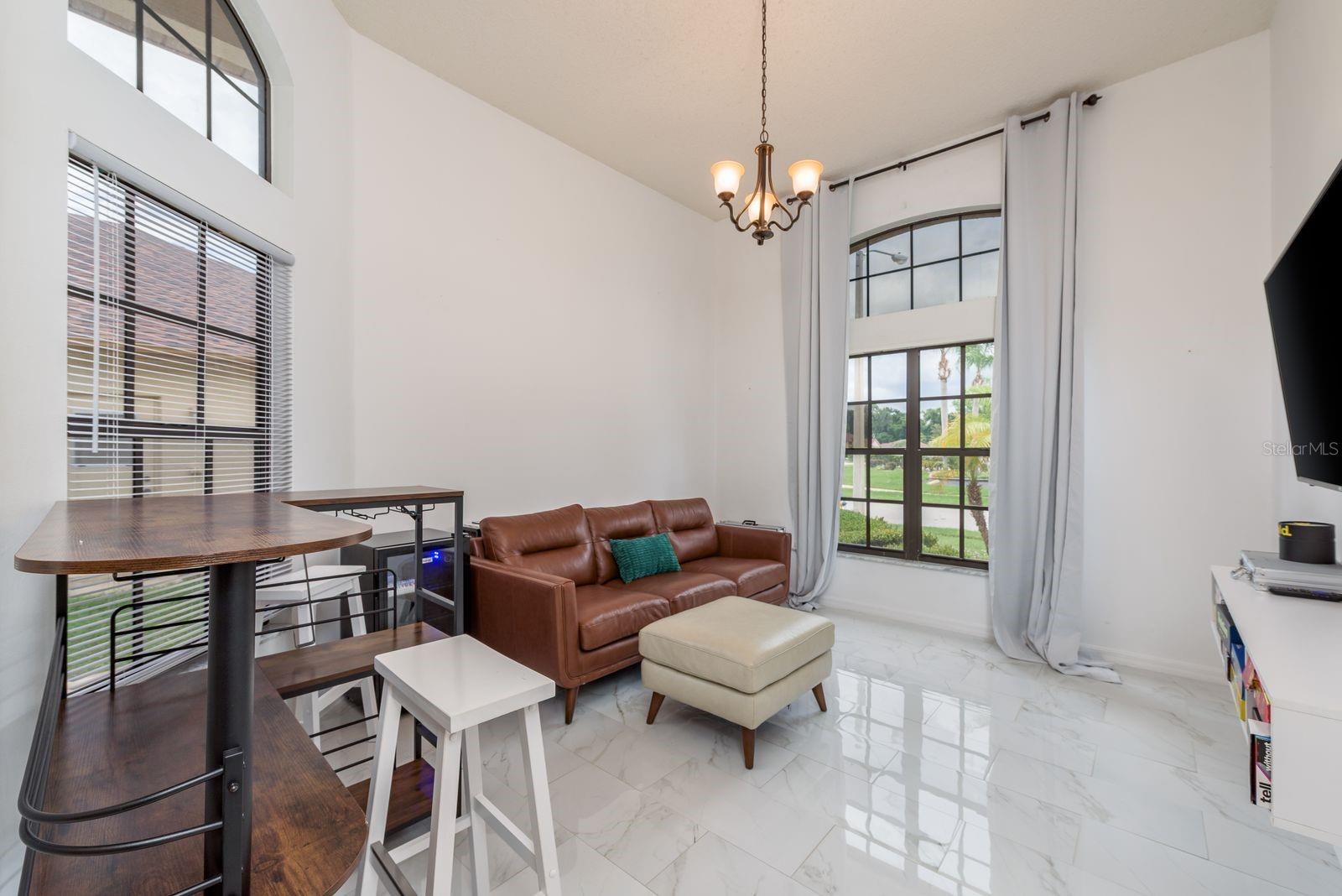 Beautiful soaring ceilings in a space that can be a dining room, formal living room, or flex space