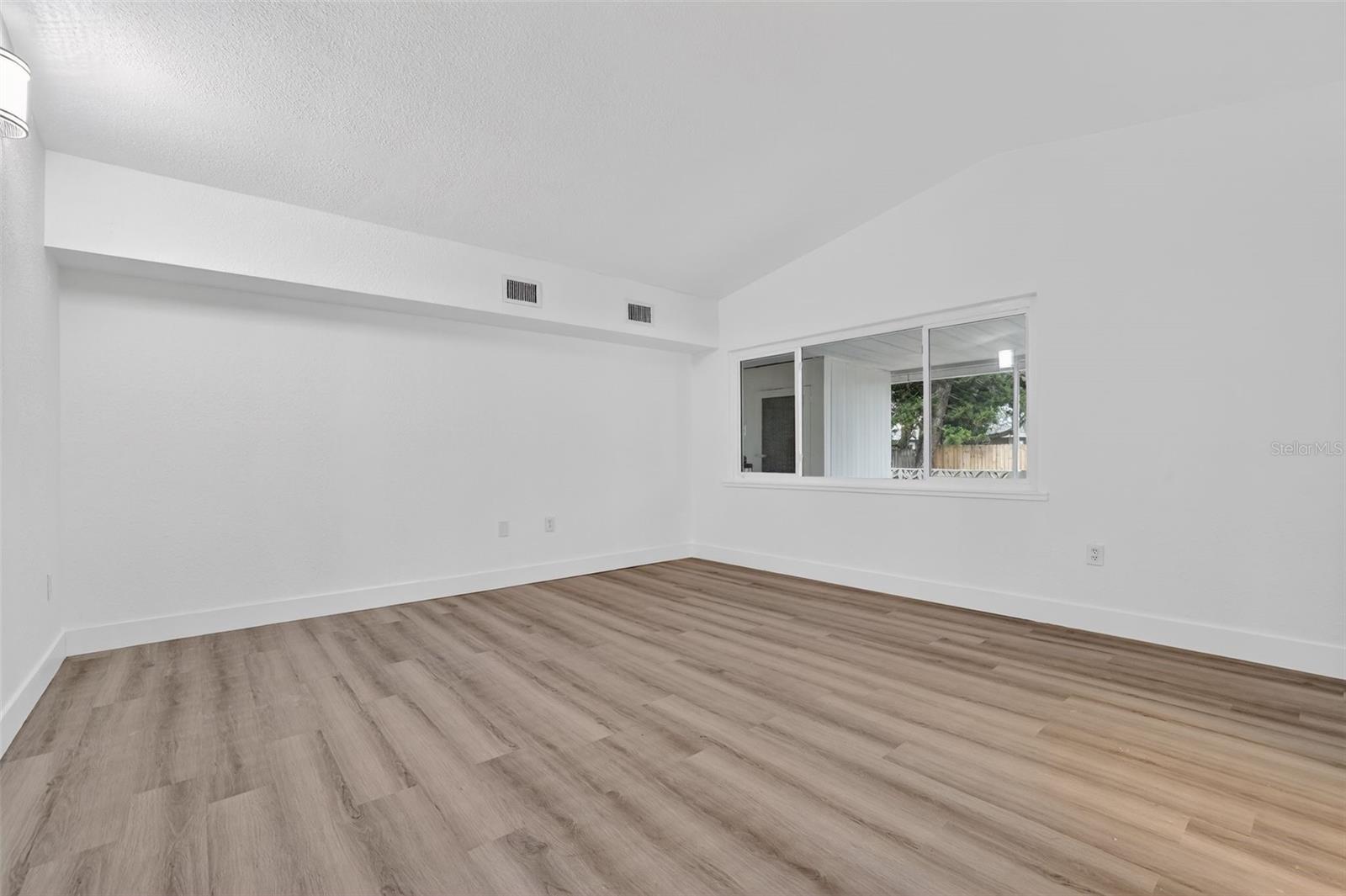 Primary bedroom with easy access to ensuite bathroom and large closet