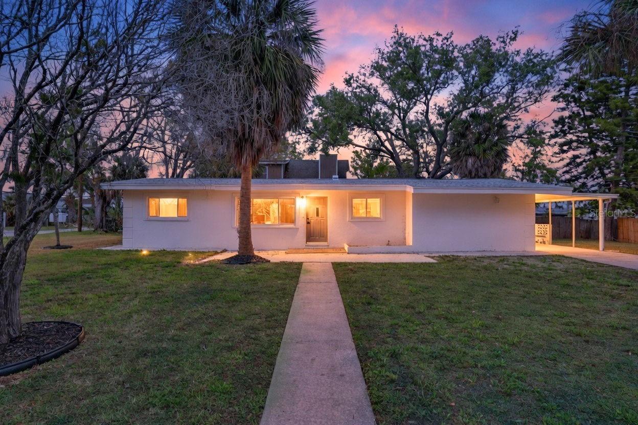 Golden hour view of this charming coastal home