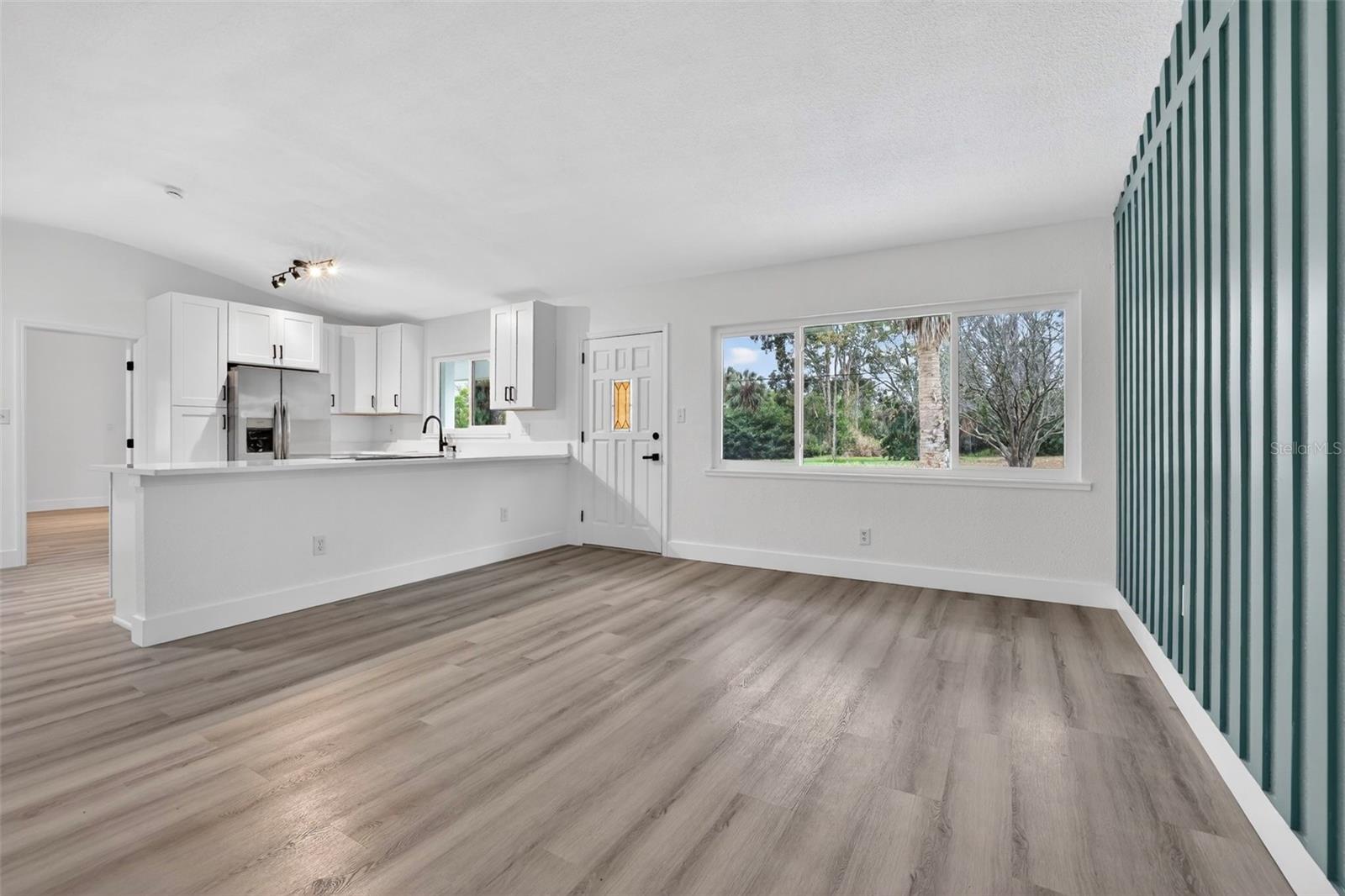 Bright living area with luxury vinyl plank flooring