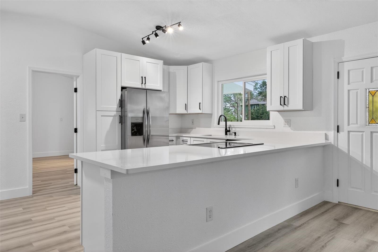 Kitchen featuring breakfast bar seating
