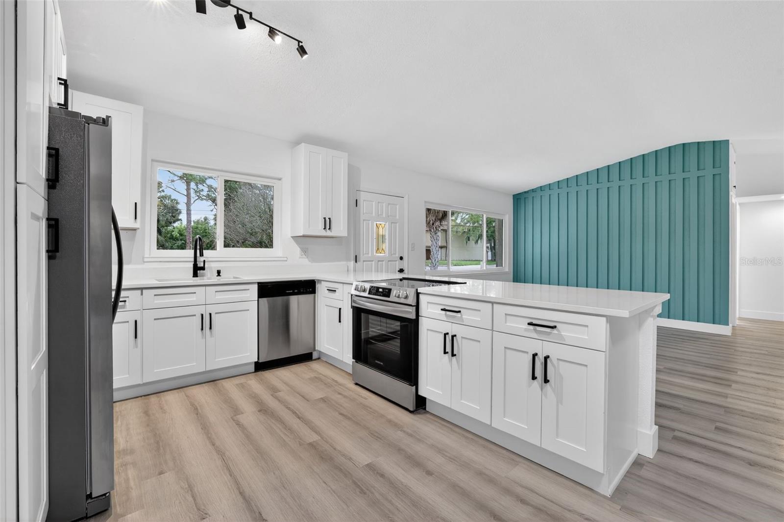 Stylish kitchen with new cabinetry and quartz counters