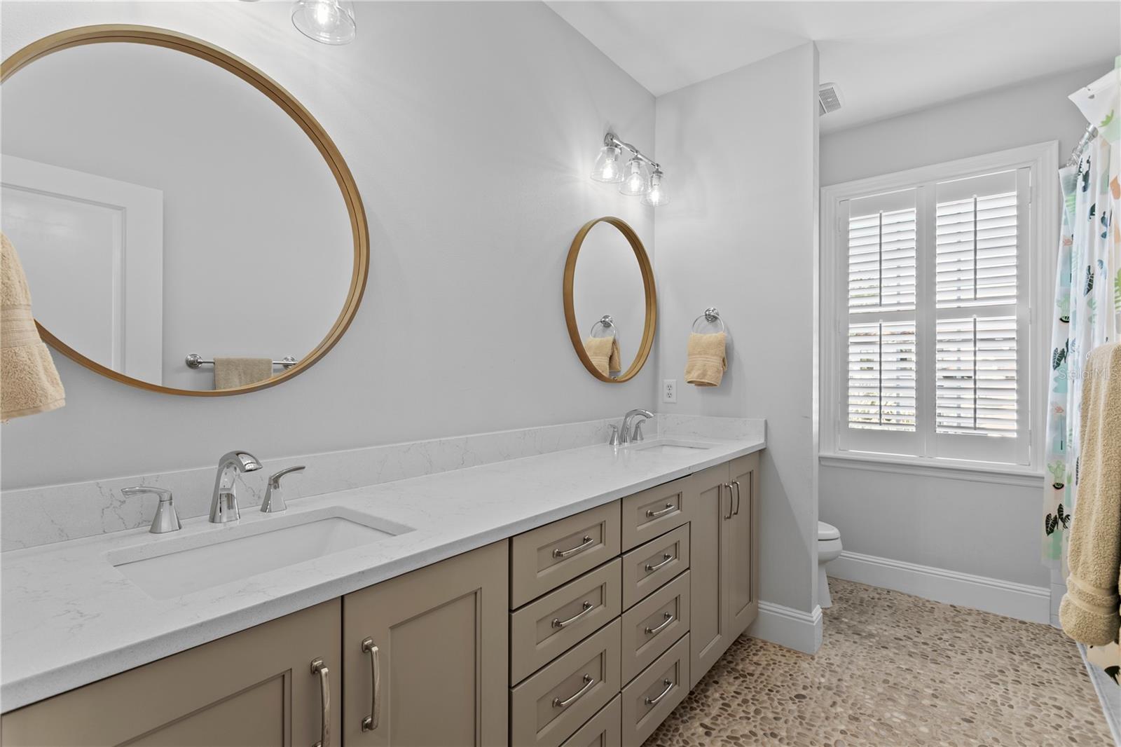 2nd Bathroom with beautiful cabinetry and dual sinks