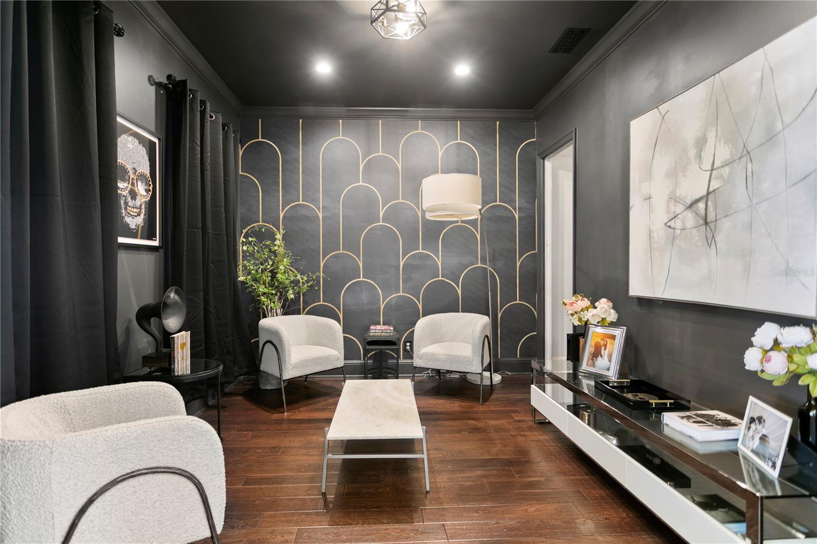 A moody front room designed for slow evenings and effortless connection.