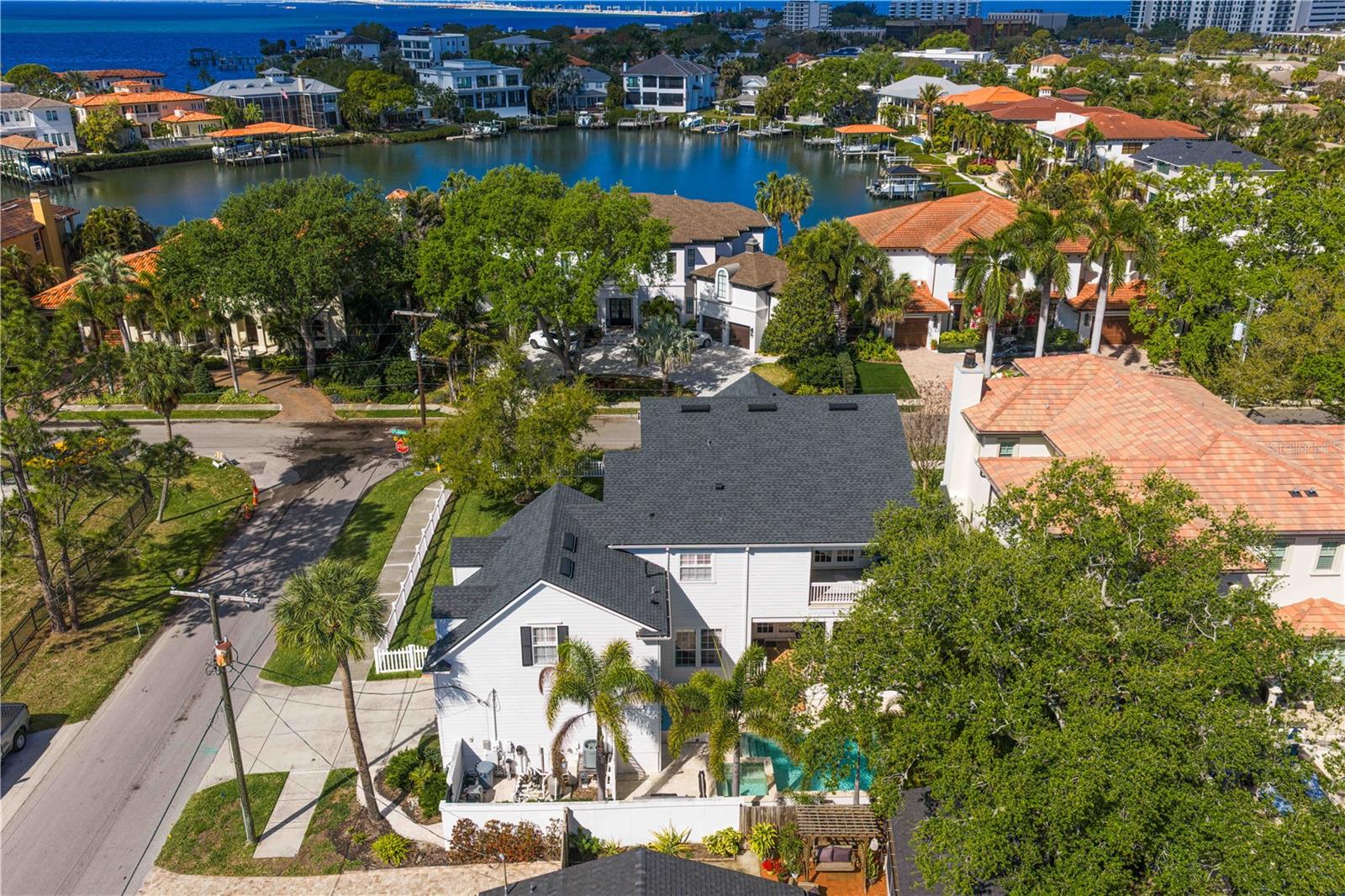 Rear of home -- directly across the street you are surrounding by gorgeous waterfront homes.