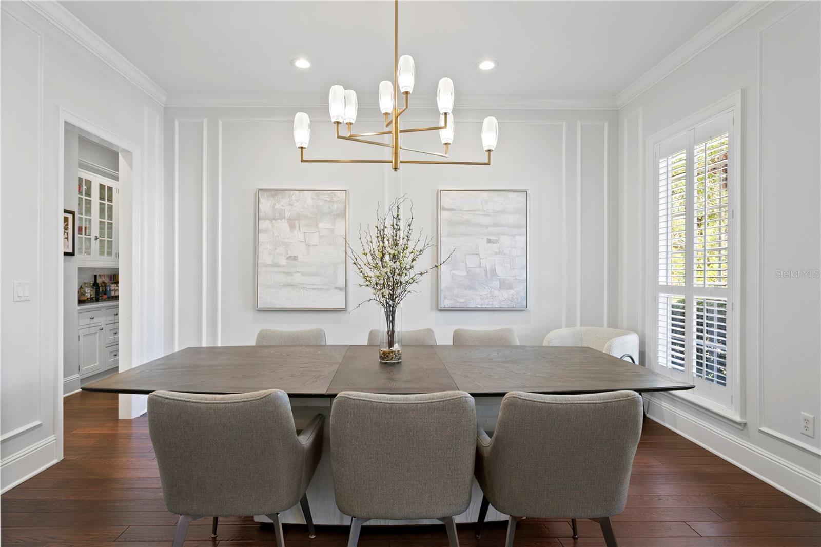 A separate dining room is light and bright