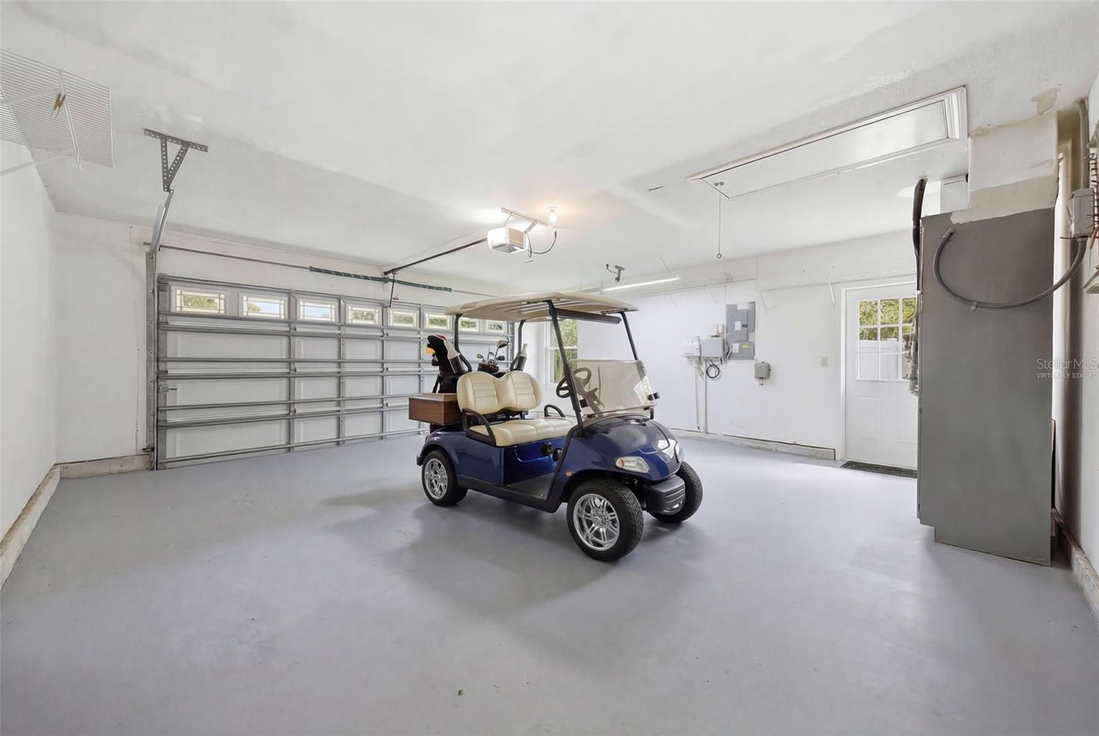 Garage floor recently painted (golf cart is virtually staged)