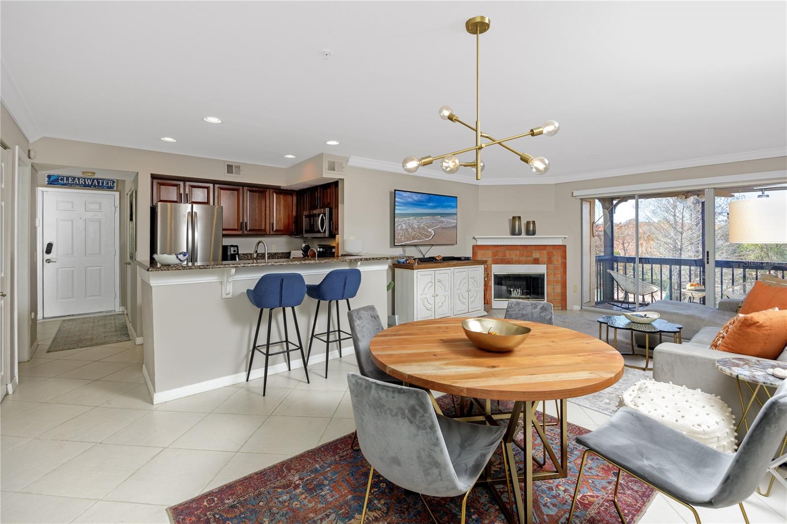 View of the kitchen with breakfast bar, dining/living room
