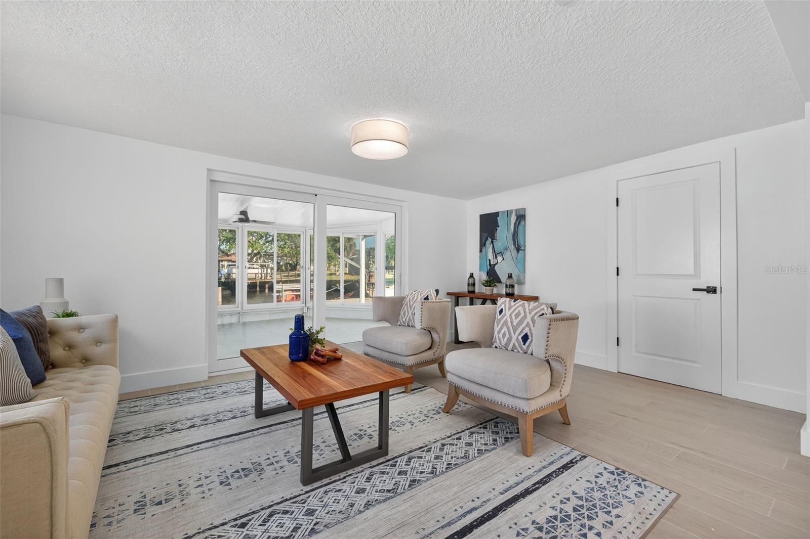 Family room with beautiful natural light and water views