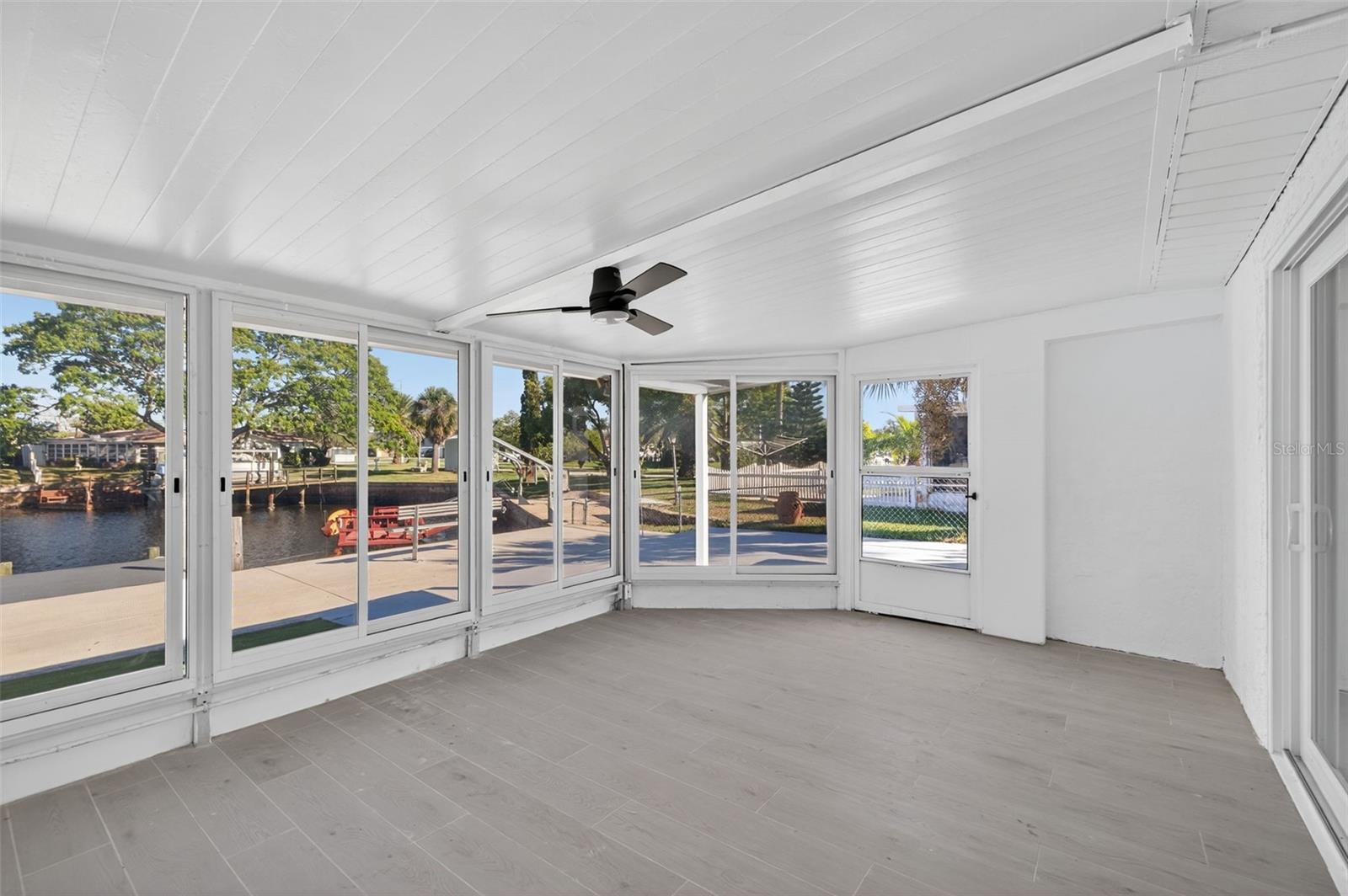 Relax and enjoy the canal views from this Florida room
