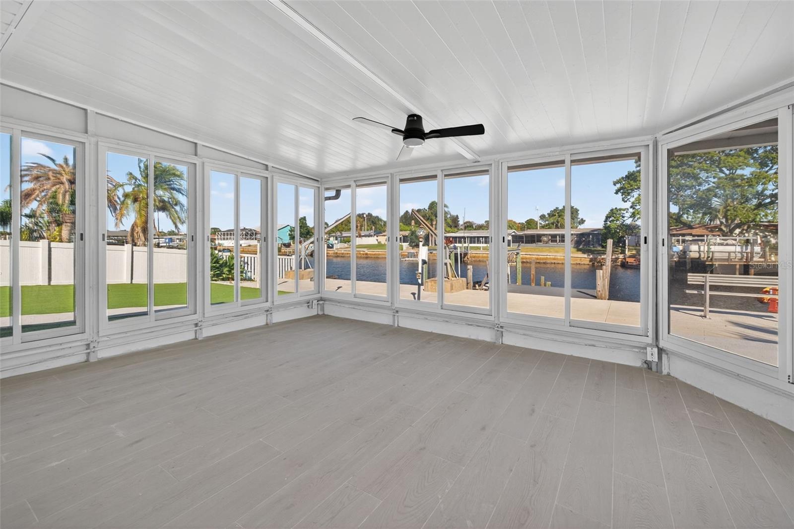 180-degree canal views from the enclosed Florida room