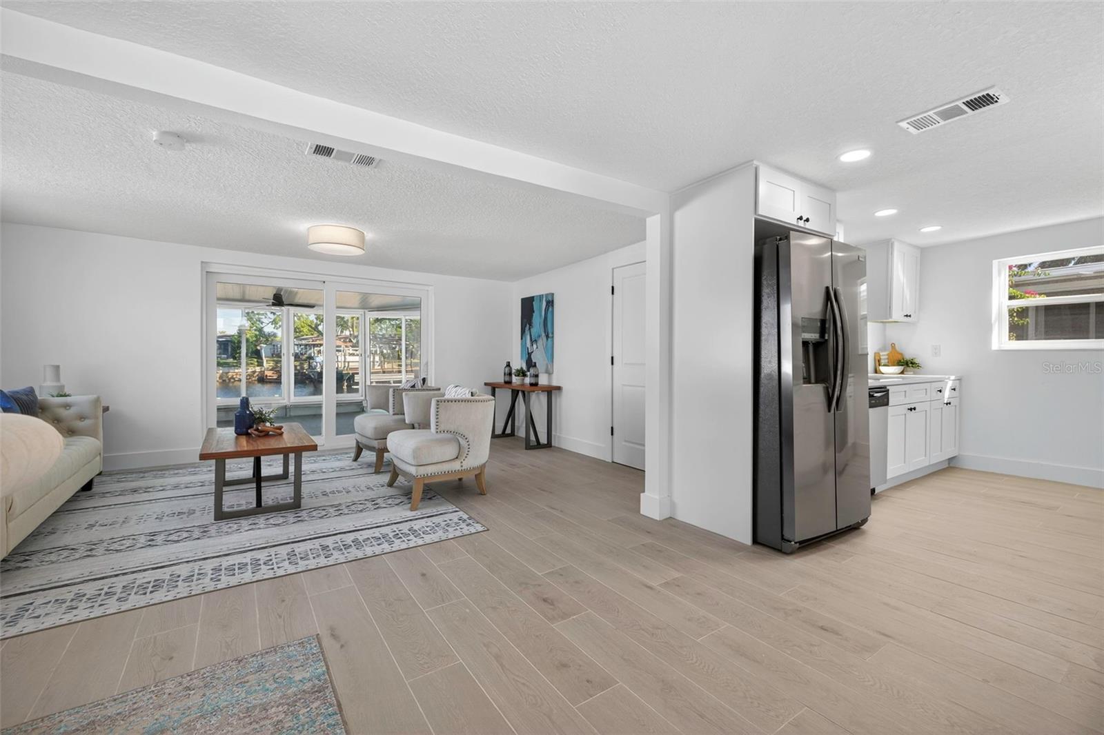 Seamless flow between kitchen, dining, and living areas
