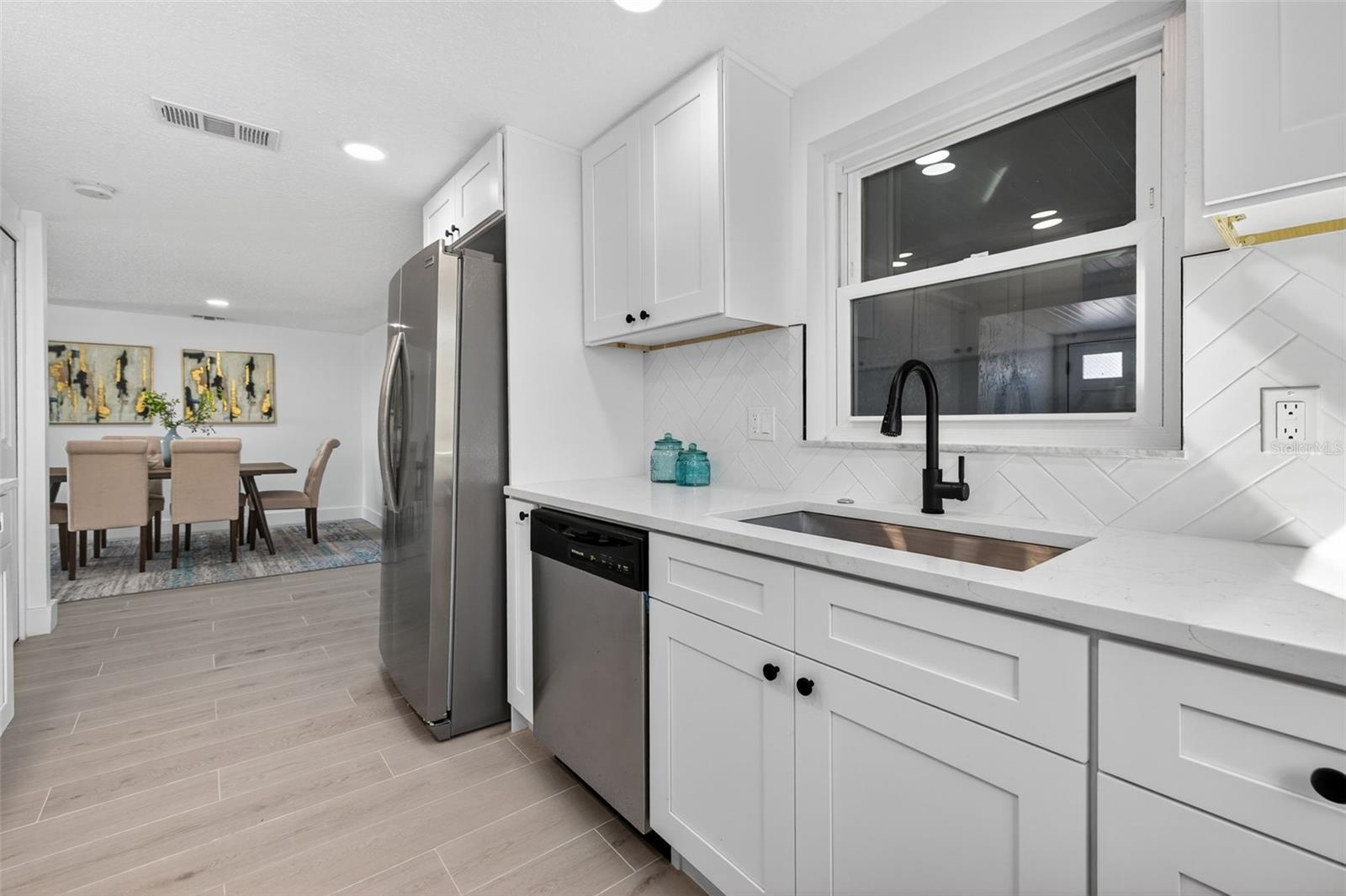 Remodeled kitchen with Carrara-style quartz countertops