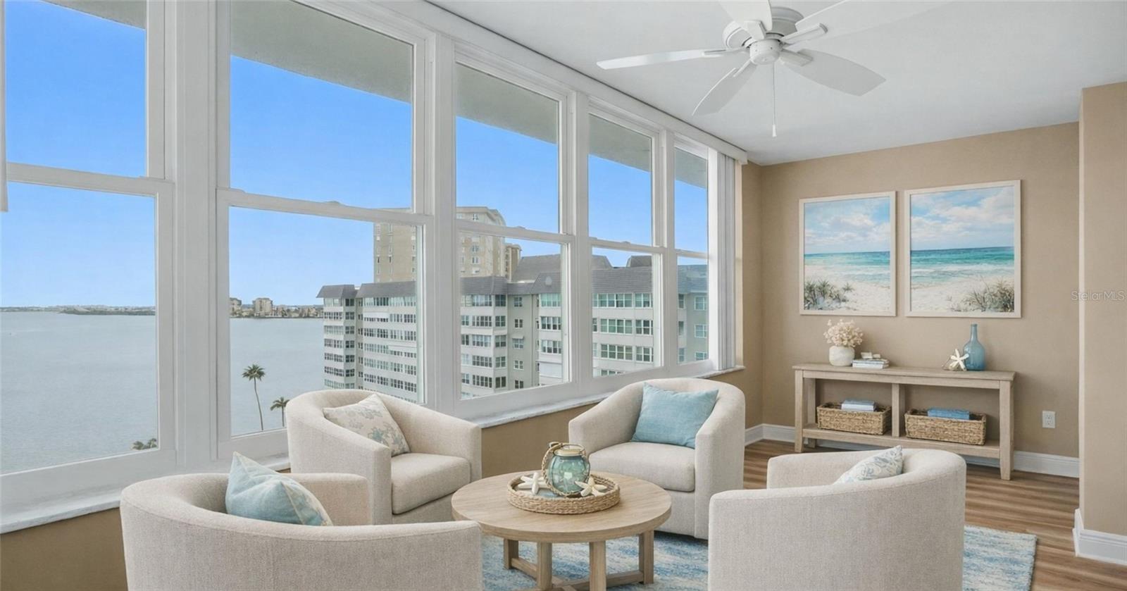 Seating area with the most amazing views of Boca Ciega Bay to be admired from the impact windows.