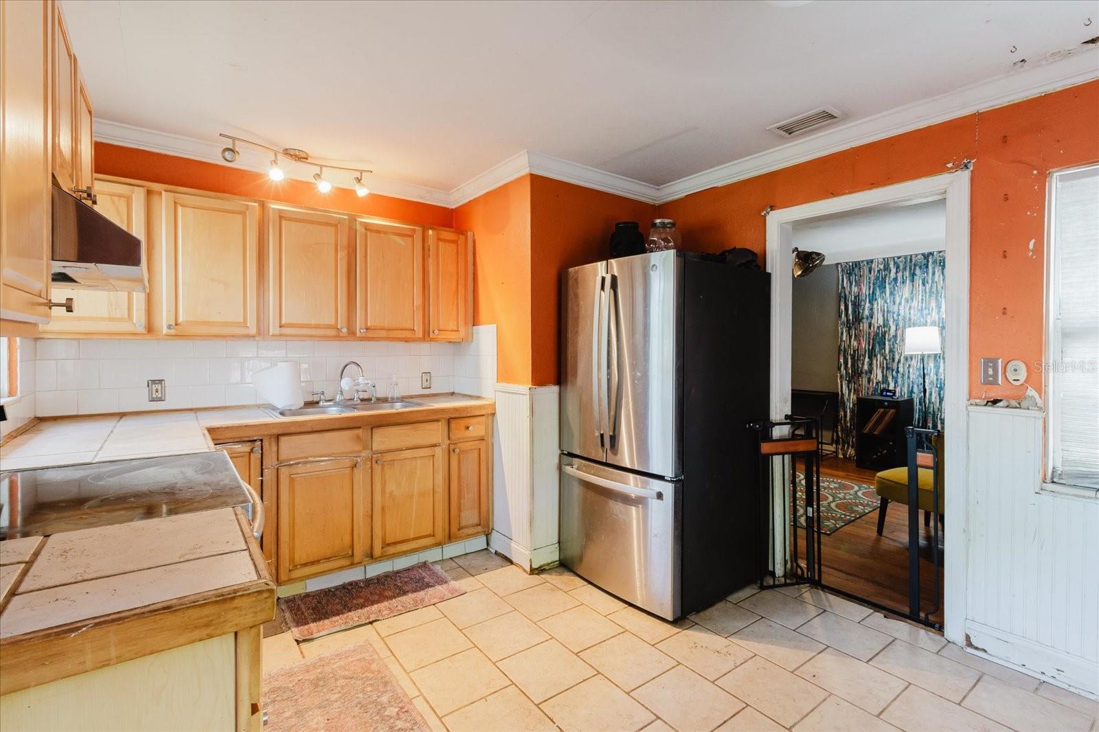 Kitchen With Doorway That Goes To The Living Room