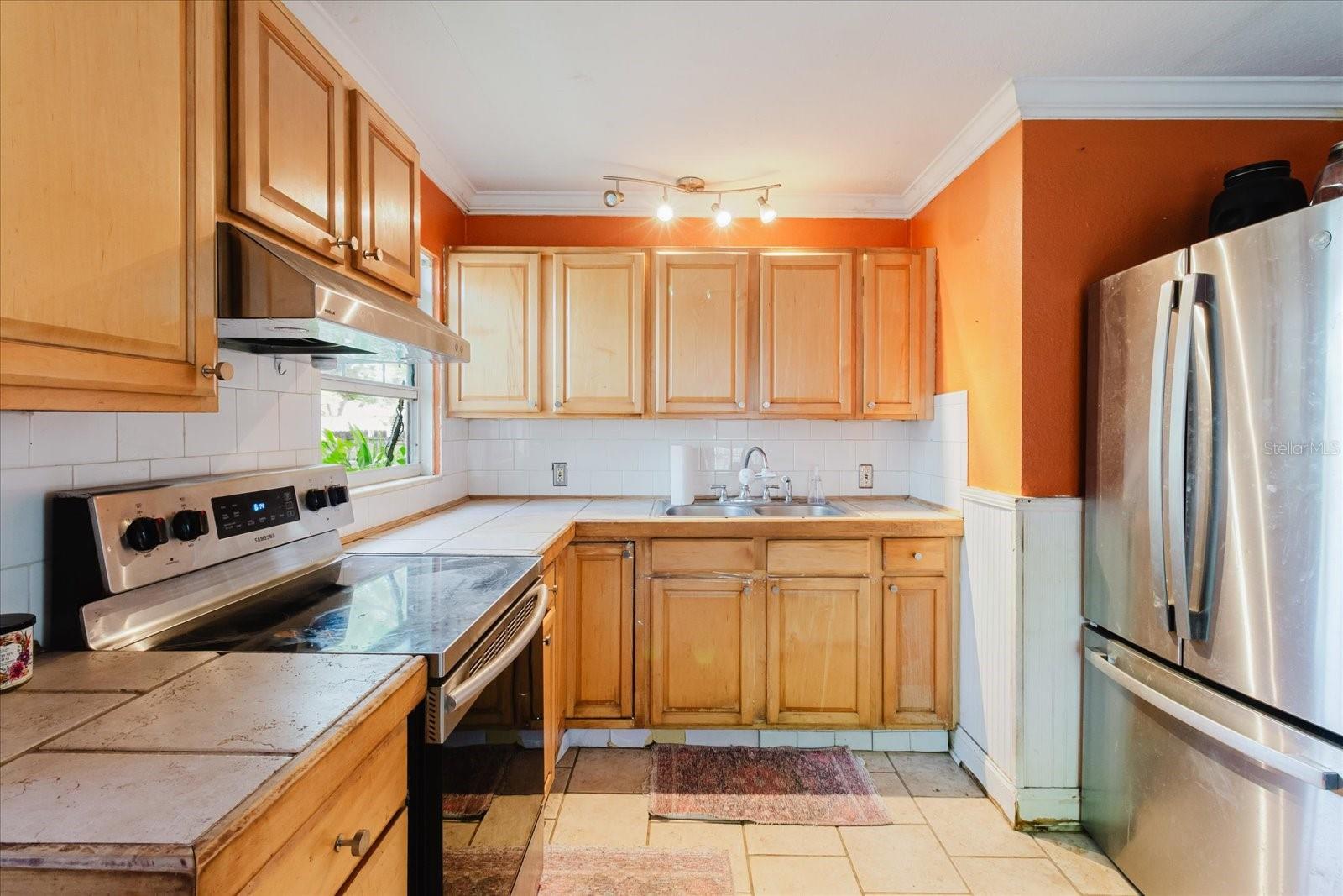 Kitchen With Tile Floors and Stainless Steel Appliances