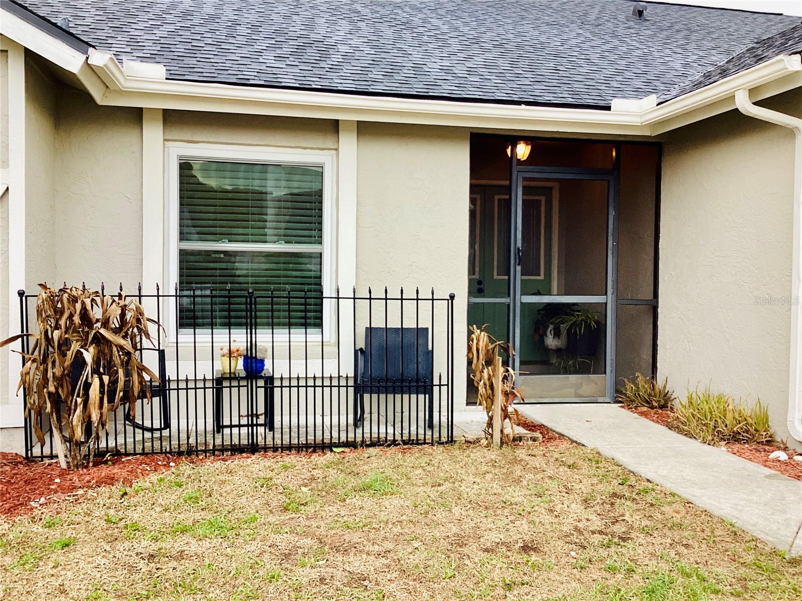 Front HouseScreened in Front porch and Metal fence area