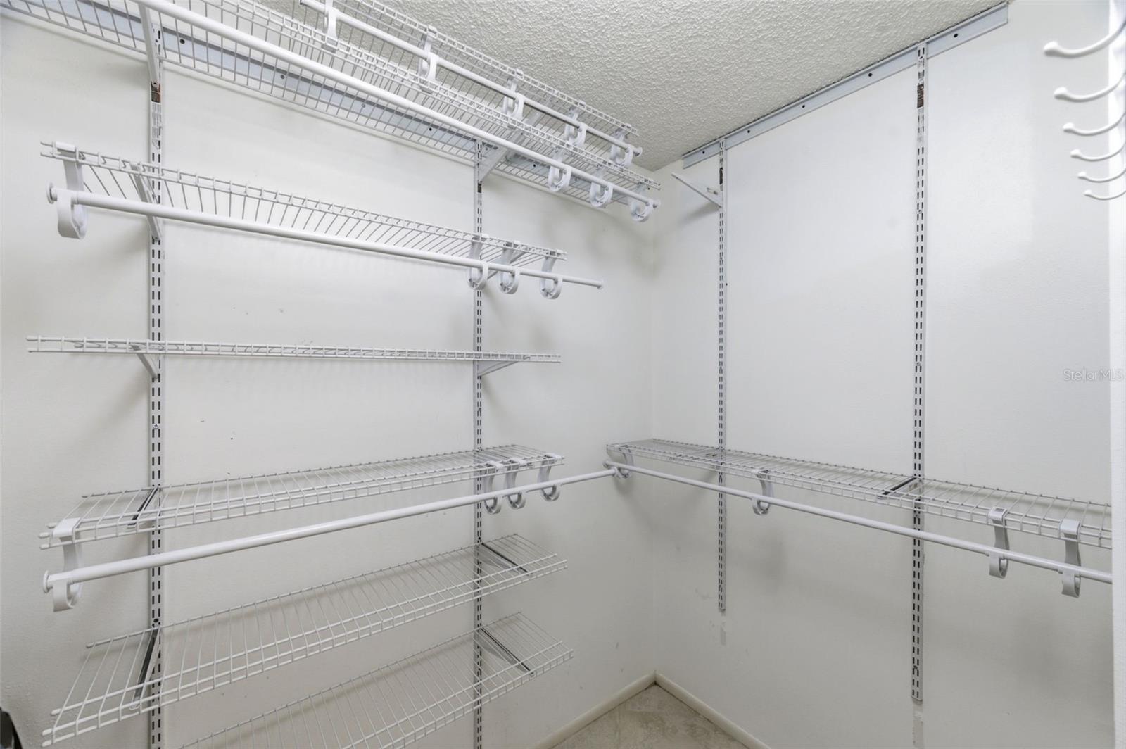 Walk-in closet in primary bedroom