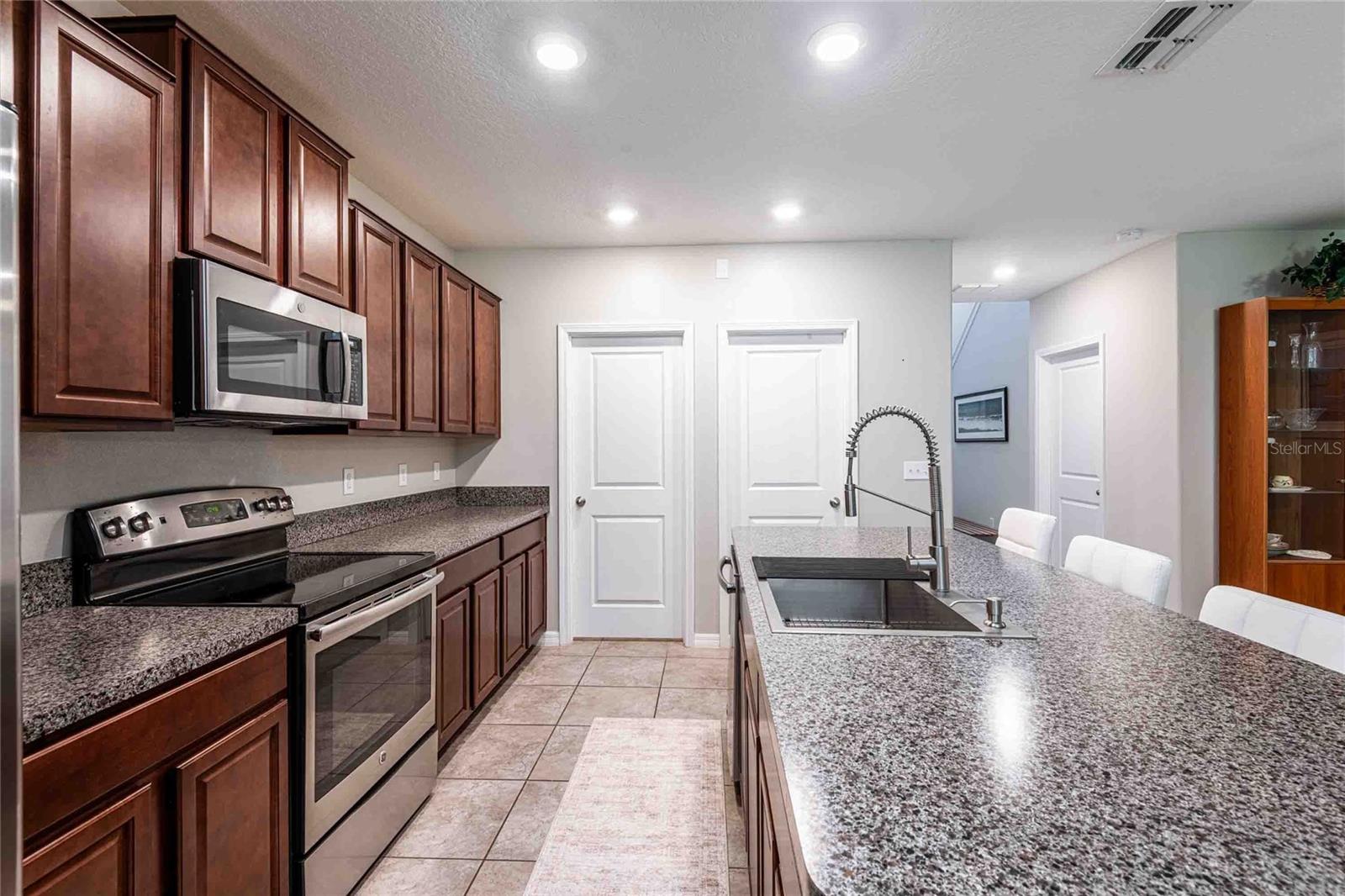 Door on the left is the laundry room and the door on the right is the pantry.